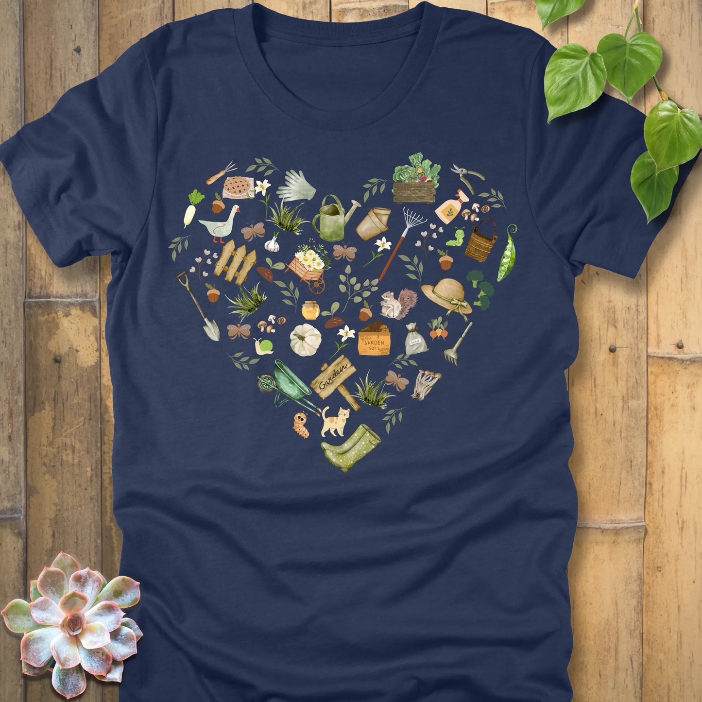 Heather Navy t-shirt featuring the design Gardening Loveheart printed in heart shape with tools, plant lover shirt.