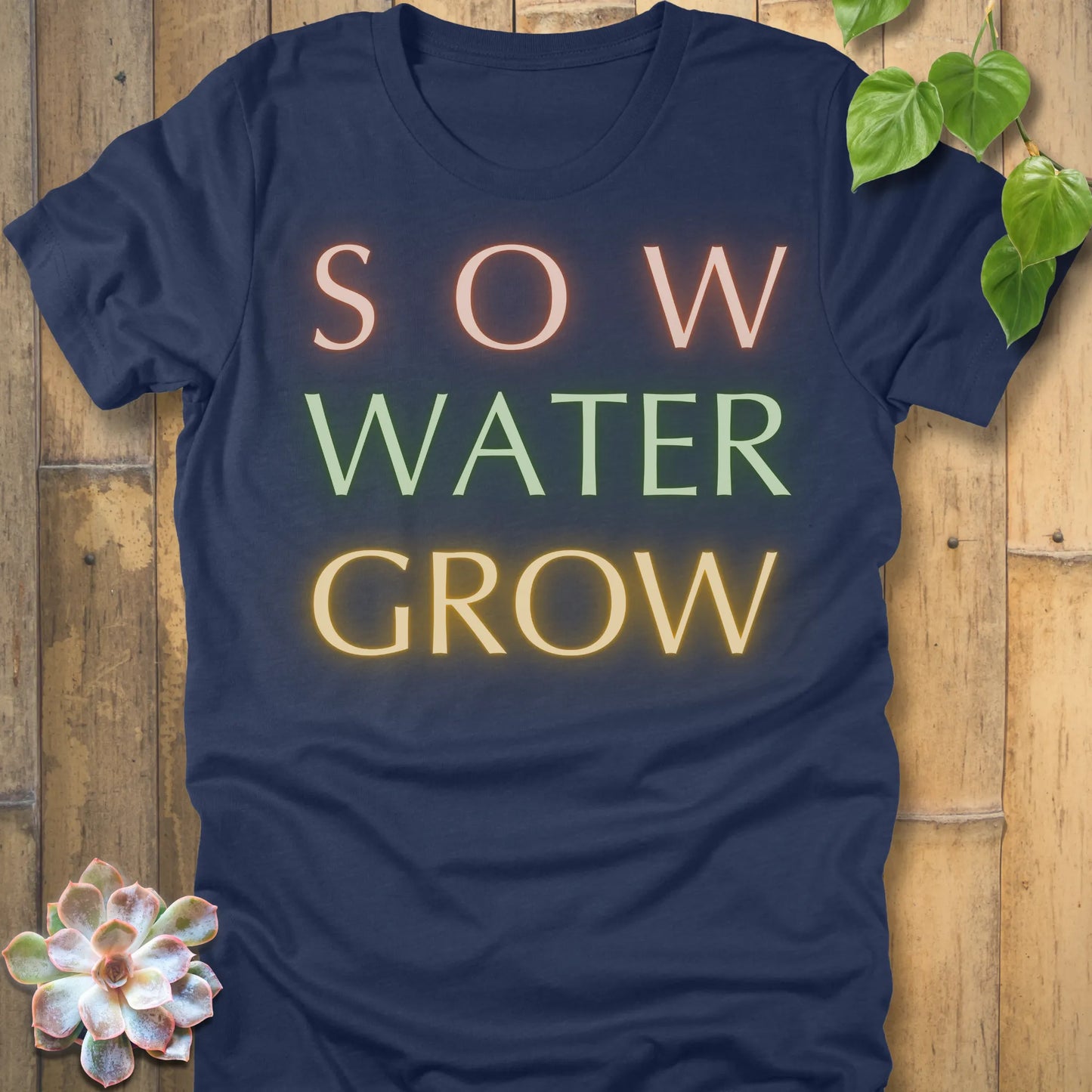 Heather Navy t-shirt featuring the design Grow Dammit printed in bold letters, funny gardening shirt.