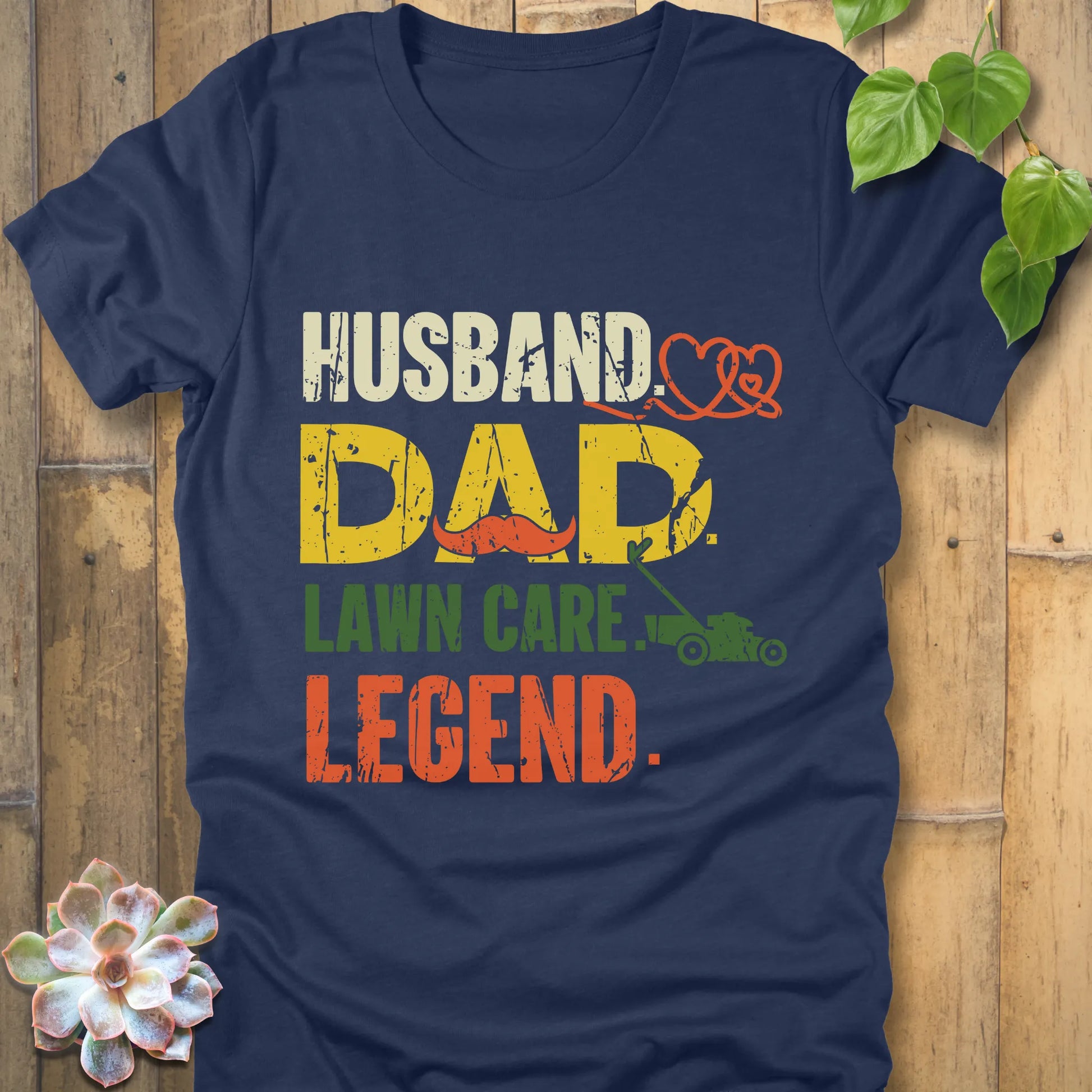 Heather Navy t-shirt featuring the design "Husband, Dad lawn care legend" printed in bold letters