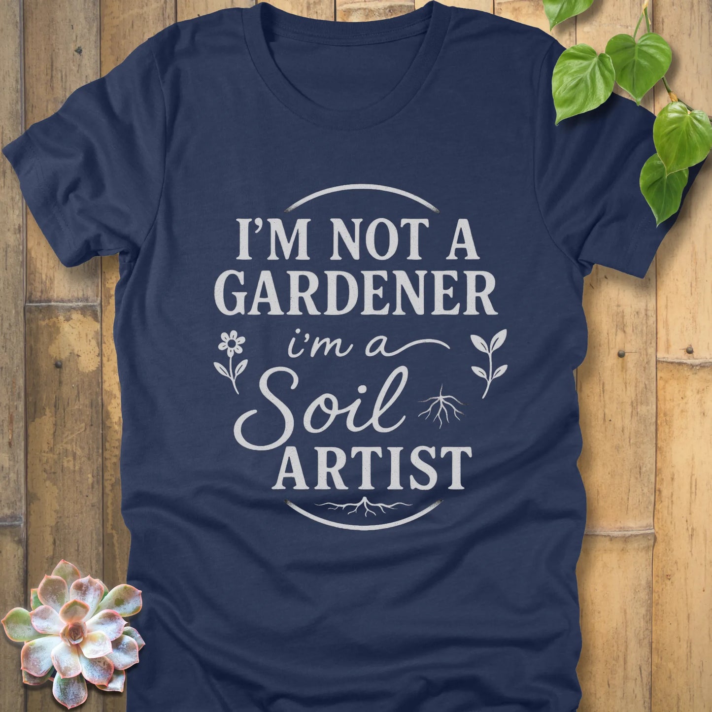 Heather Navy t-shirt featuring the design I'm Not a Gardener I'm a Soil Artist printed in bold white letters