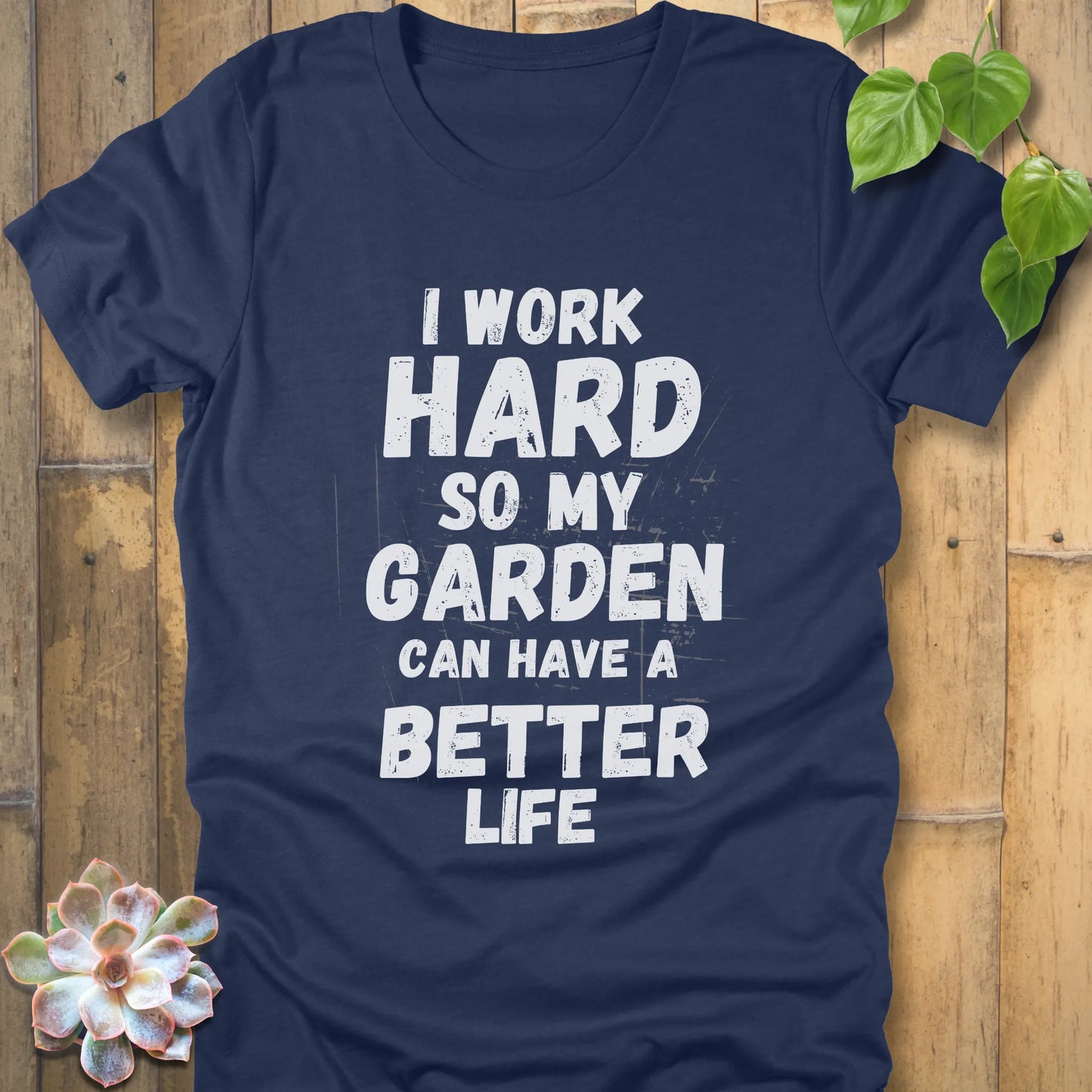 Heather Navy t-shirt featuring the design I work hard so my garden can have a better life in bold lettering.