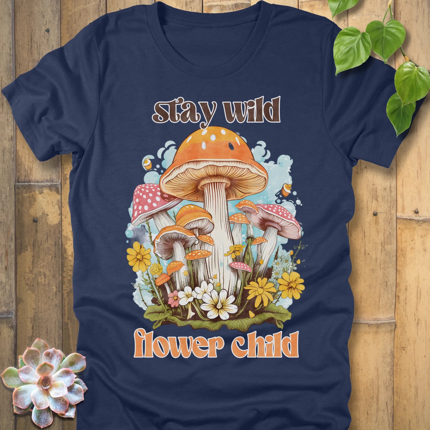 Heather Navy t-shirt featuring the design Stay Wild Flower printed in bold letters, floral graphic tee.