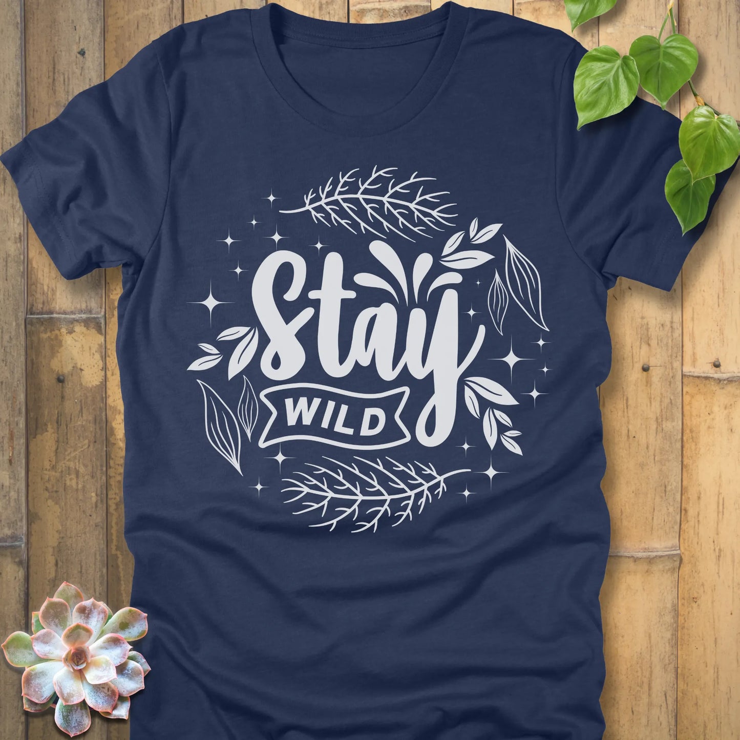 Heather Navy t-shirt featuring the design Stay Wild printed in white letters, nature lover shirt.