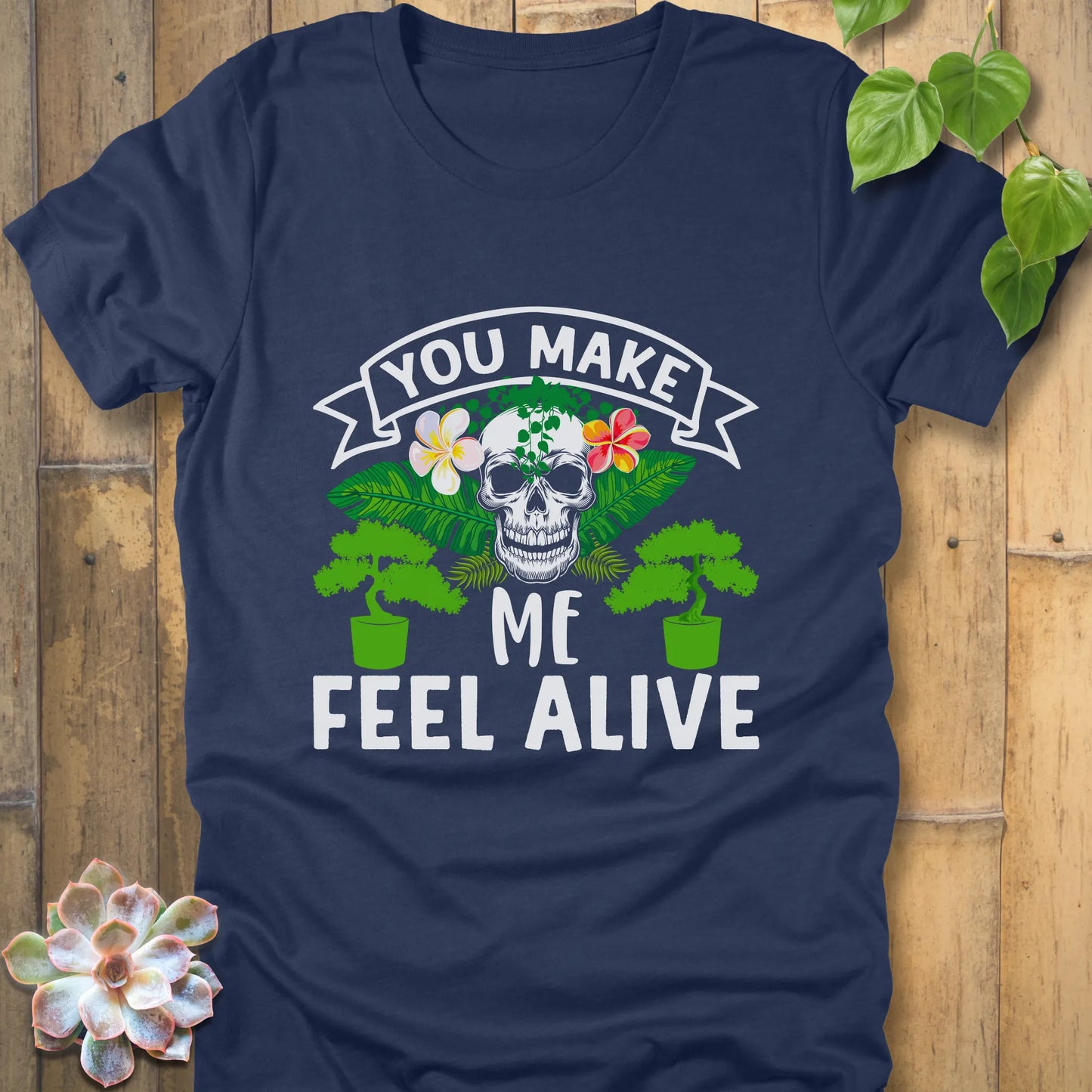 Heather Navy t-shirt featuring the design You Make Me Feel Alive printed in bold white letters with skull and plants