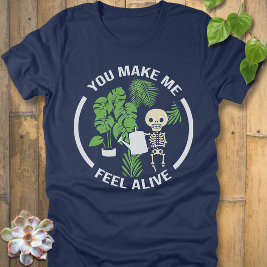 Heather Navy t-shirt featuring the design You make me feel alive with plant and skeleton in bold white letters