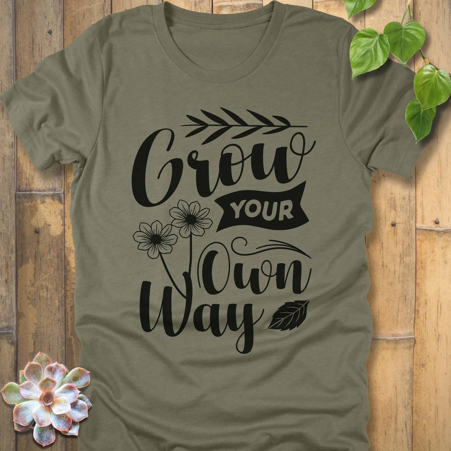 Heather Olive cotton graphic t-shirt featuring the inspirational phrase Grow your own way, stylish casual wear.