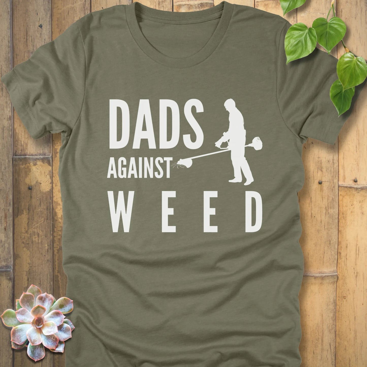 Heather Olive t-shirt featuring the design Dads Against Weed printed with man mowing.