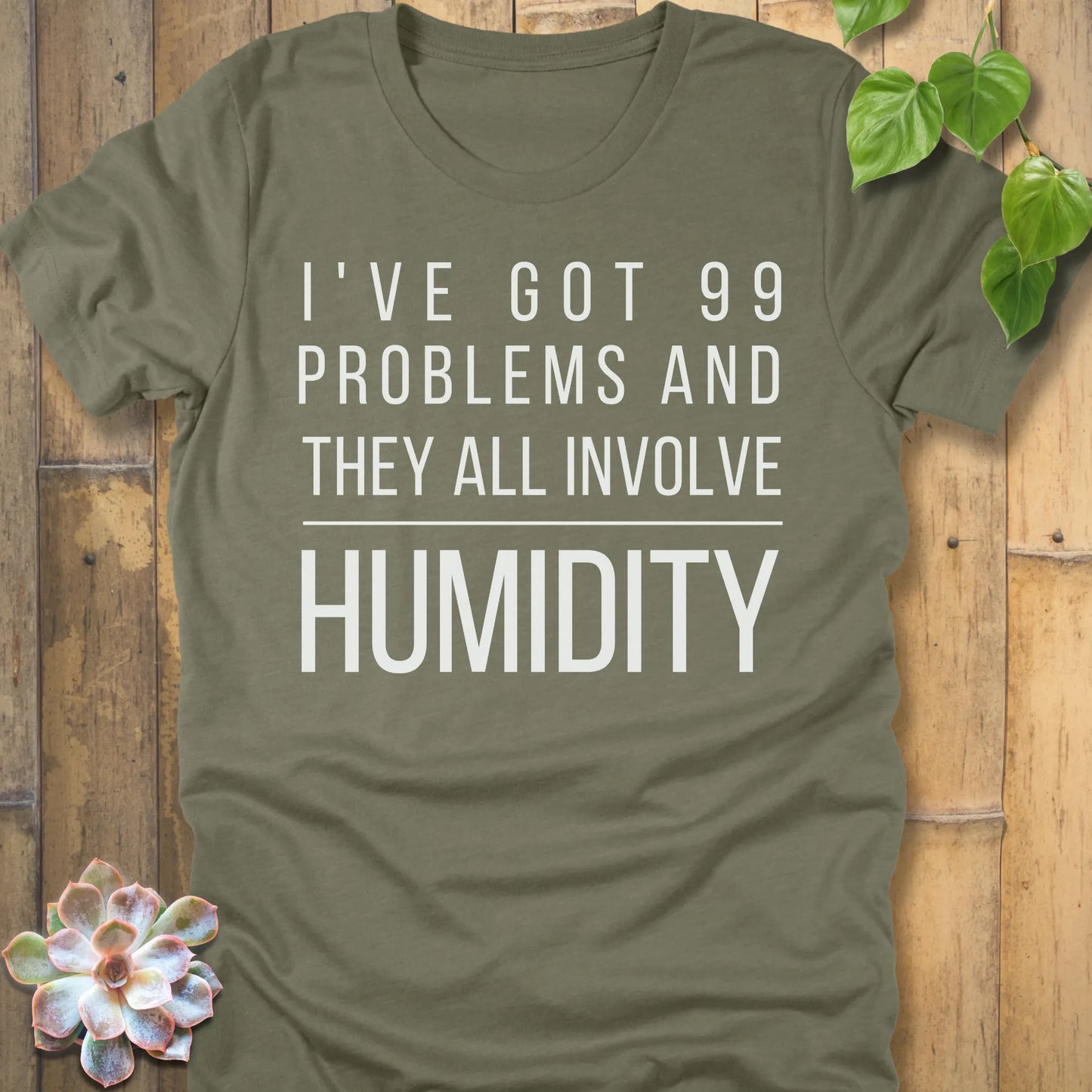Heather Olive t-shirt featuring the design I've Got 99 Problems printed in bold white letters