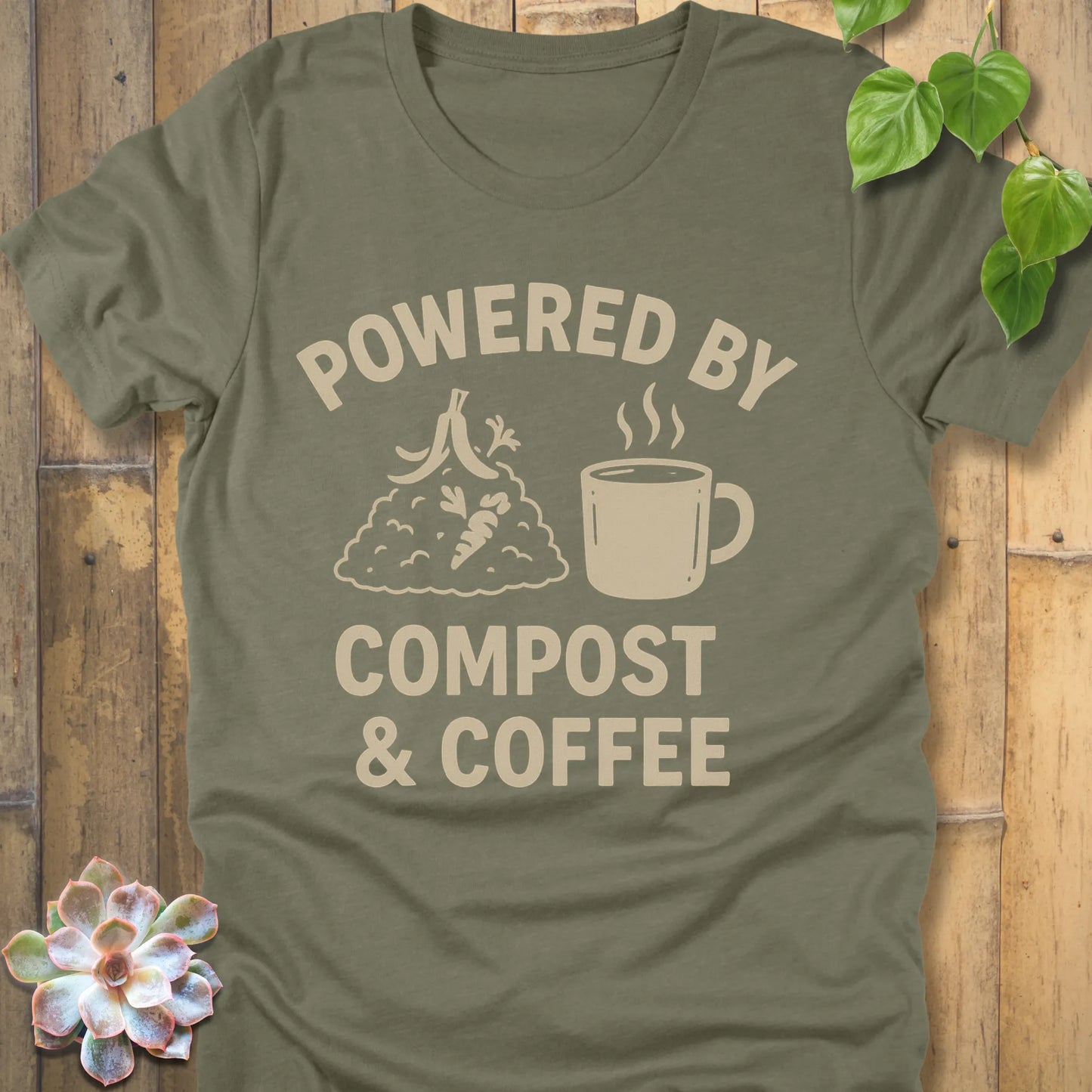 Heather Olive t-shirt featuring the design Powered By Compost & Coffee printed in bold letters with mug of coffee