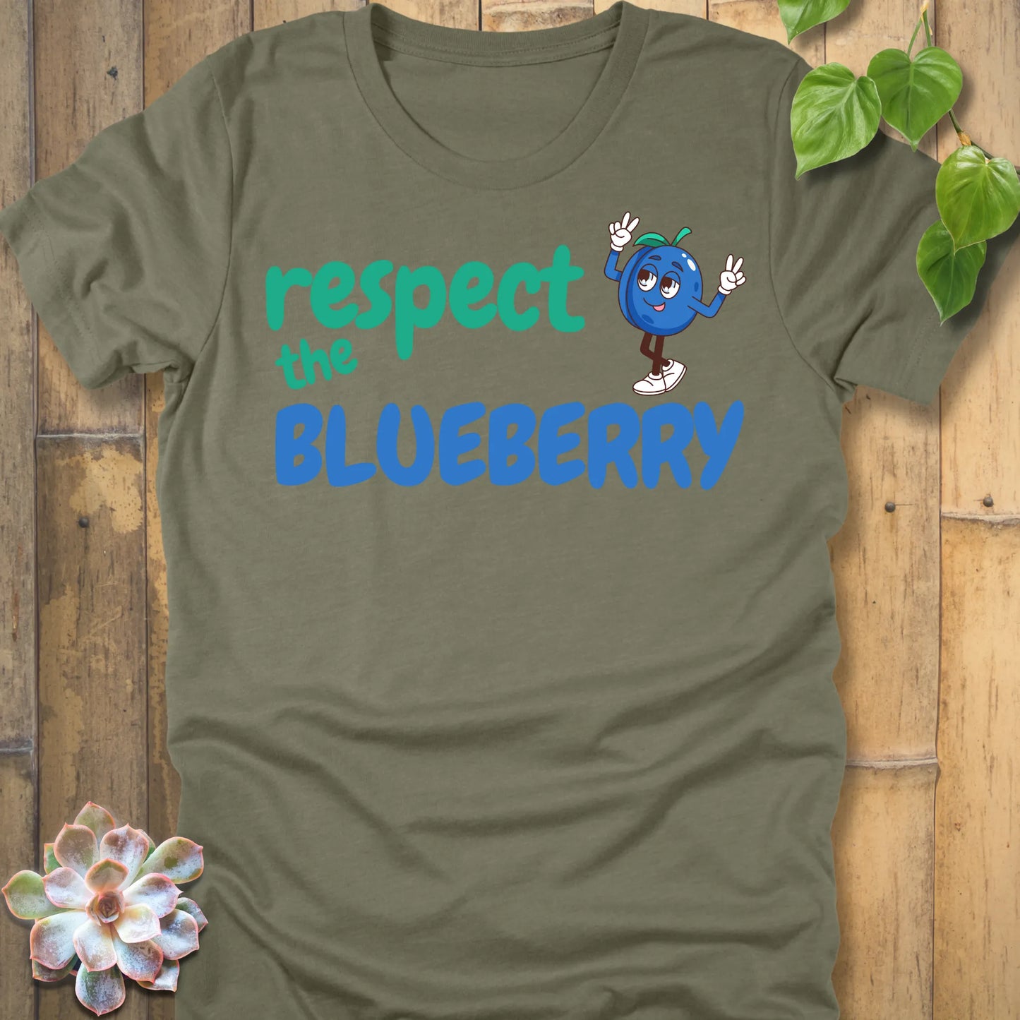 Heather Olive t-shirt featuring the design Respect the Blueberry with a bold blueberry graphic, funny fruit lover shirt.