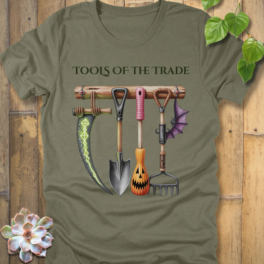 Heather Olive t-shirt featuring the design Tools of the Trade printed in bold letters with a halloween tools