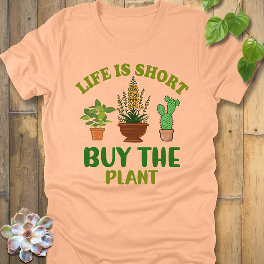 Heather Peace t-shirt featuring the design Life is short, buy the plant printed in green letter with plant illustration