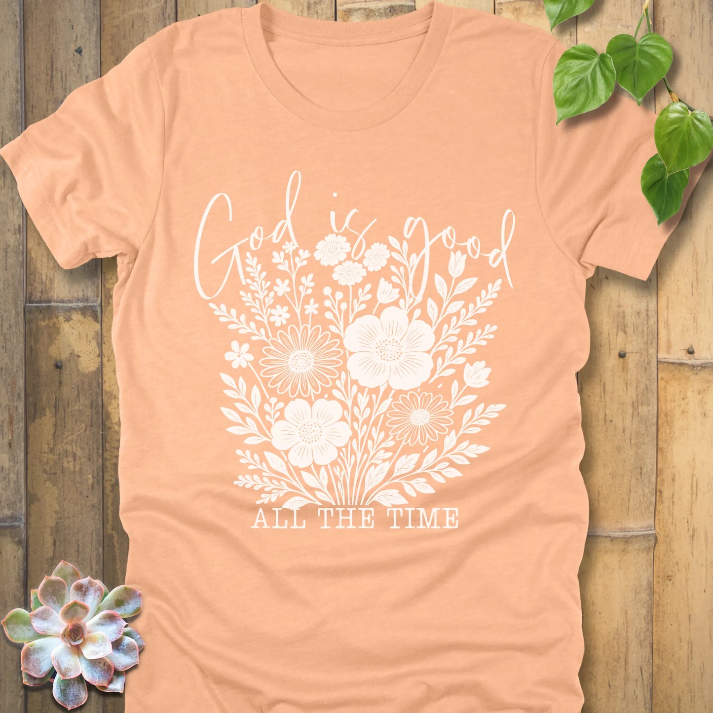 Heather Peach t-shirt featuring the design God is Good printed with flowers in a soft floral style