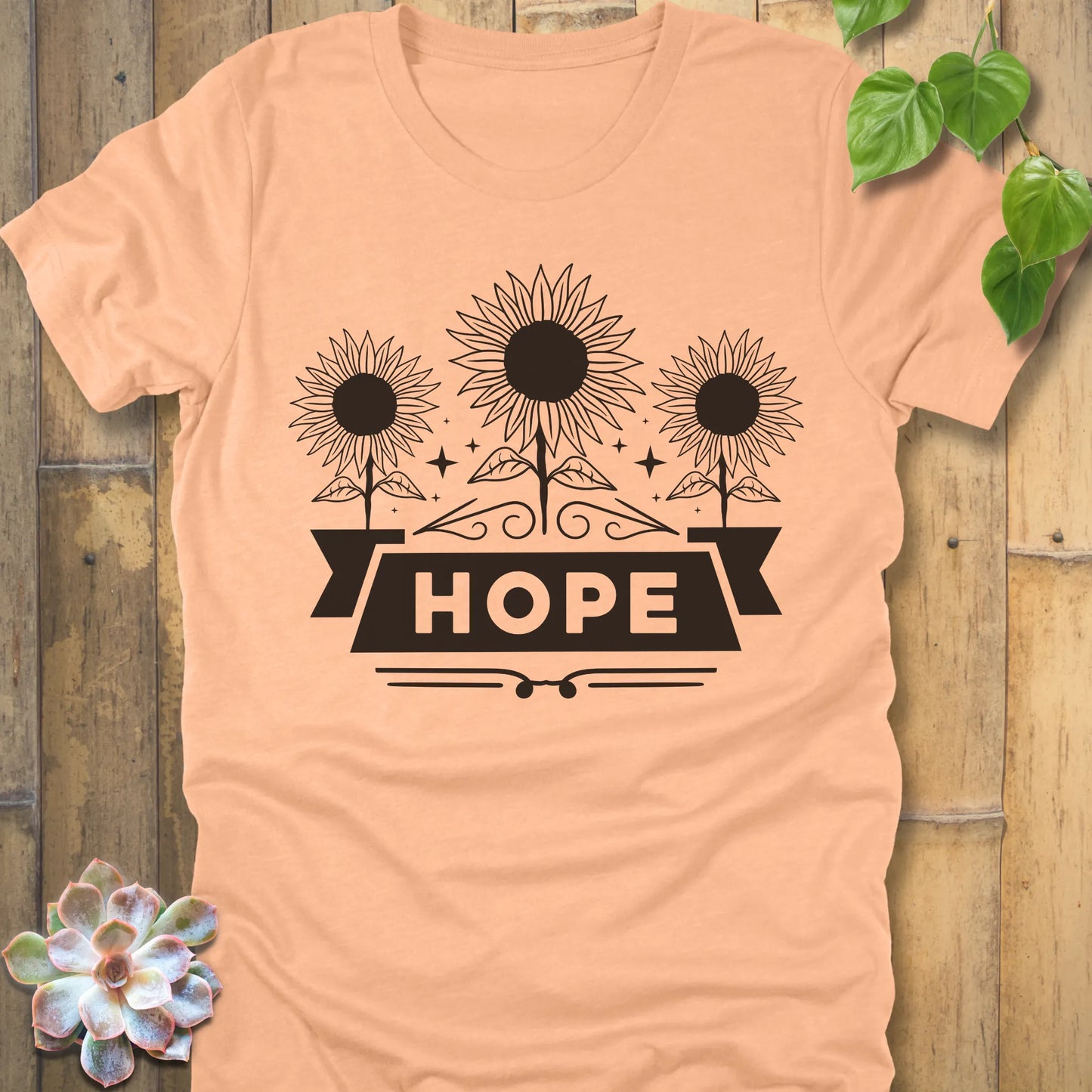 Heather Peach t-shirt featuring the design Hope with bold letters and 3 sunflower print
