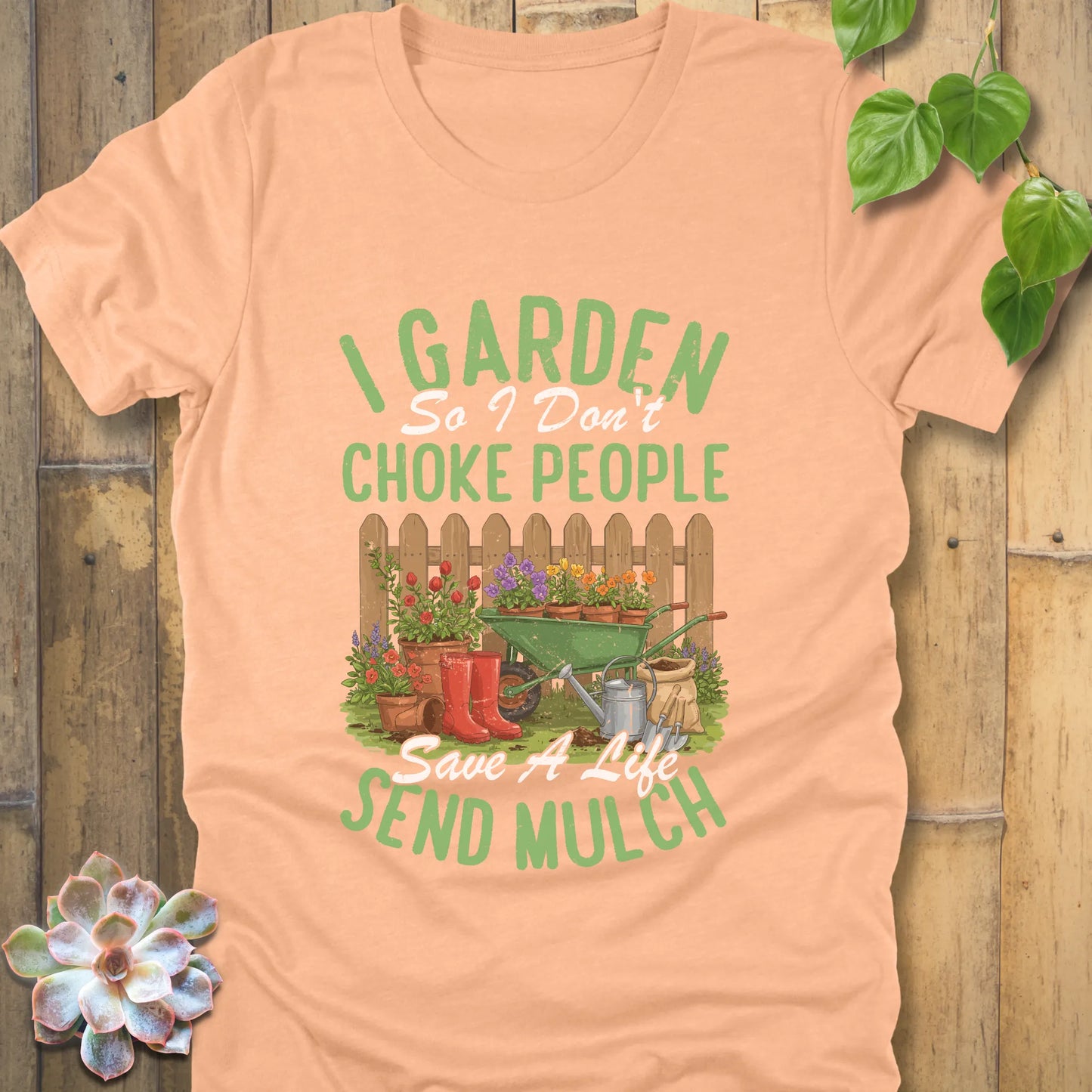 Heather Peach t-shirt featuring the design 'I garden so I don't choke people, save a life send mulch' with plants and tools graphic