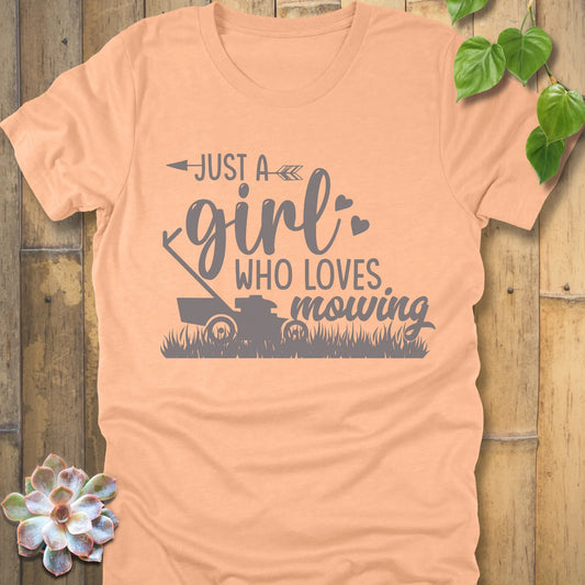 Heather Peach t-shirt featuring the design Just a girl who loves mowing printed with a lawn mower graphic.