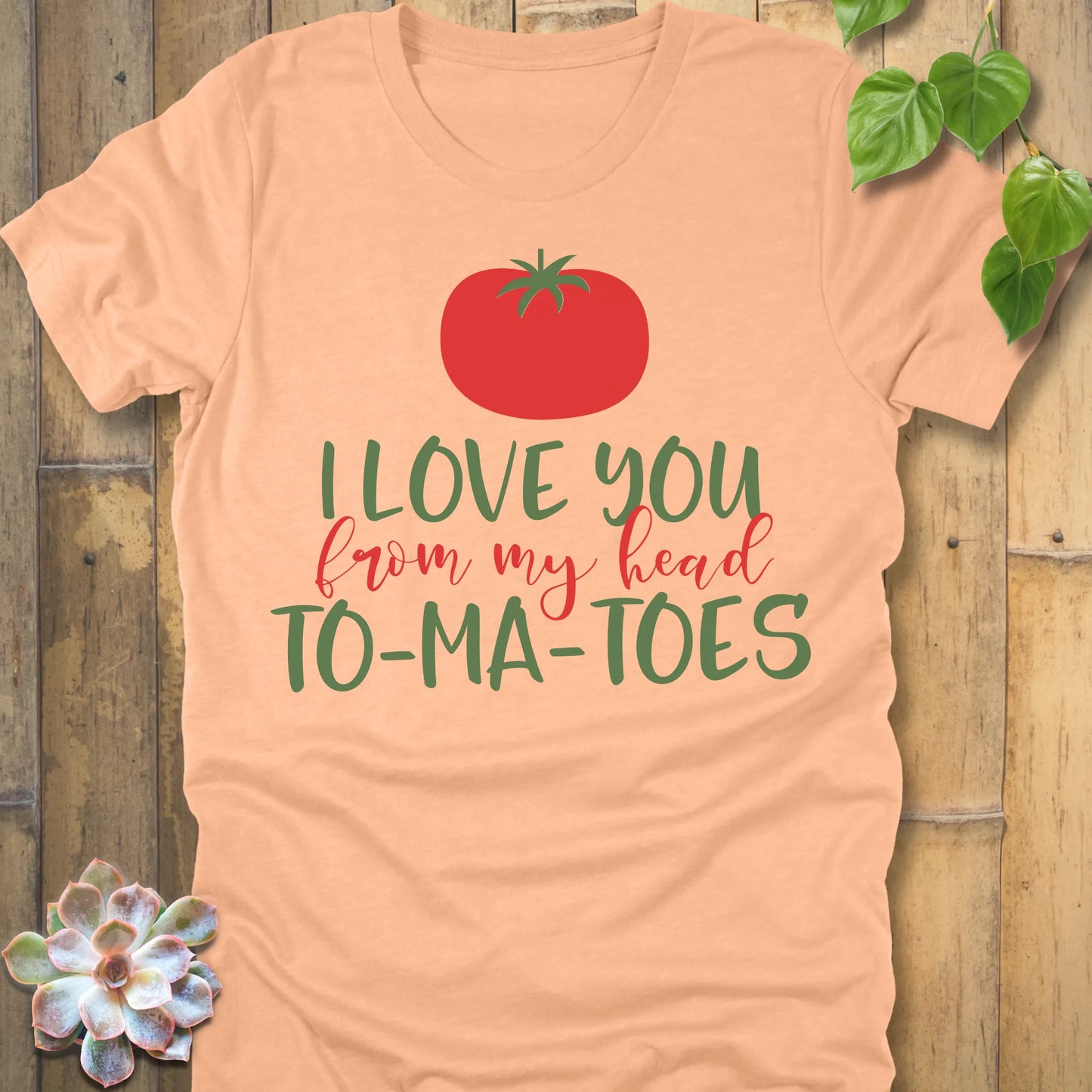 Heather Peach t-shirt featuring the design My Head To-Ma-Toes printed in bold letters, funny tomato gardening shirt.