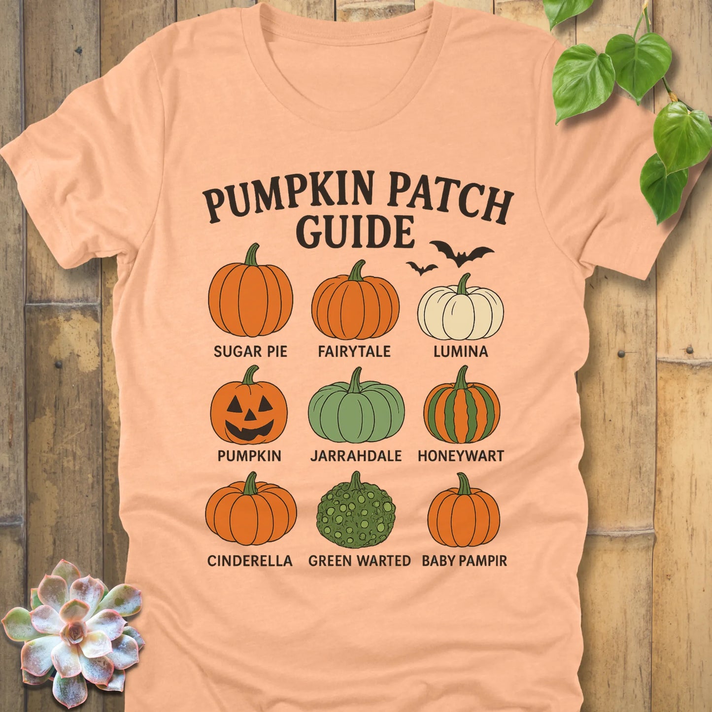 Heather Peach t-shirt featuring the design Pumpkin Patch Guide printed in bold black letters and pumpkin
