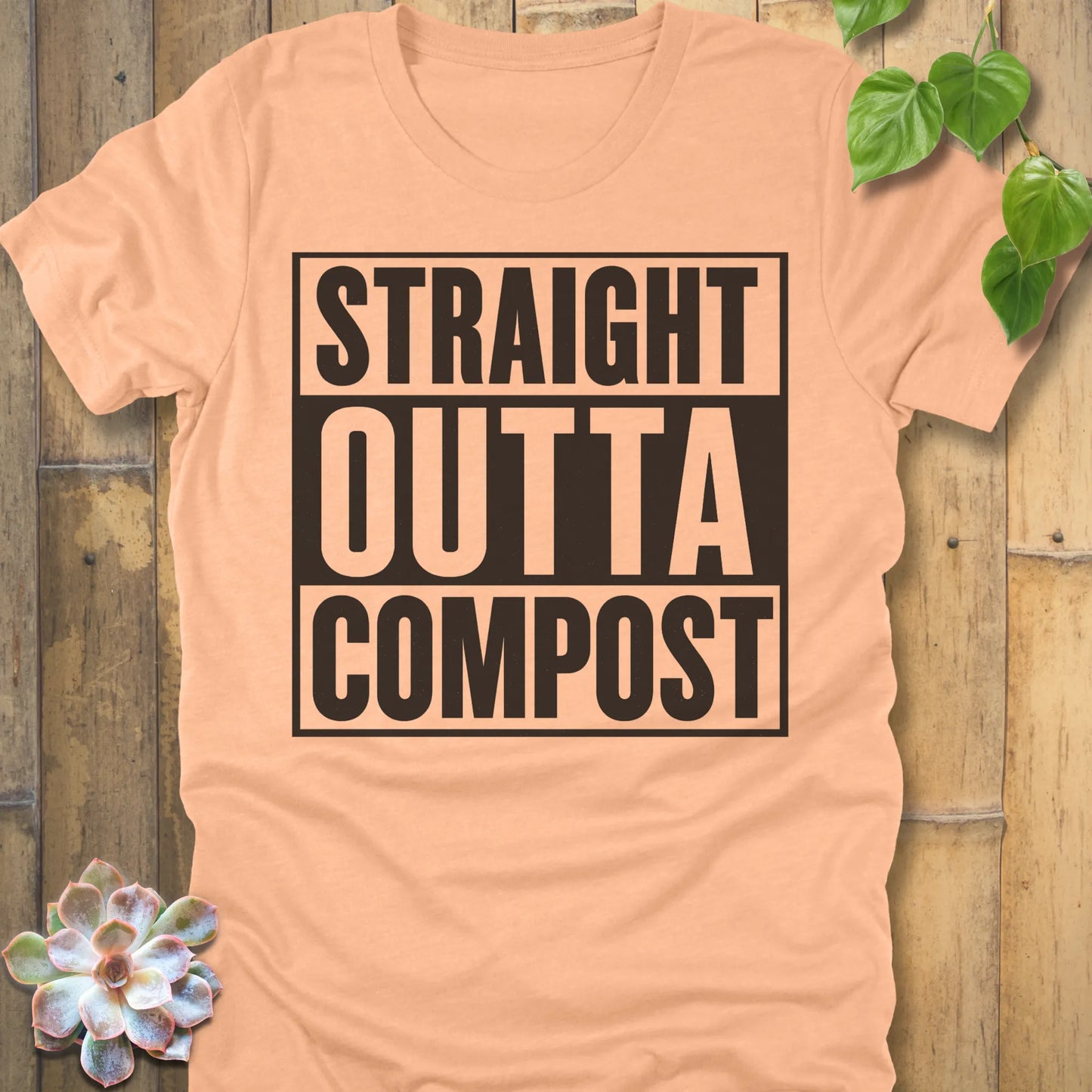 Heather Peach t-shirt featuring the design Straight Outta Compost printed in bold letters, funny gardening shirt.