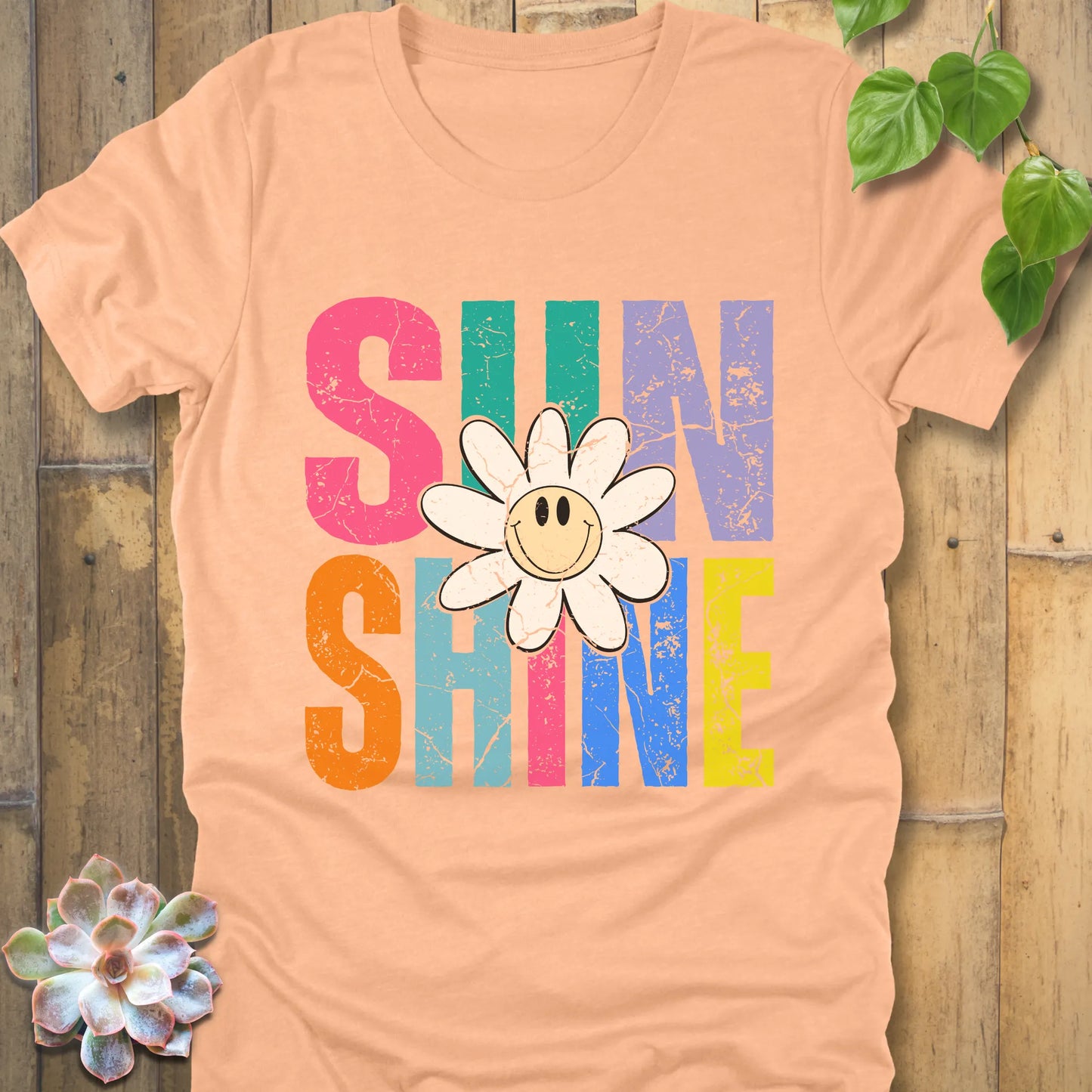 Heather Peach t-shirt featuring the design Sunshine printed in colourful letters and a sunflower