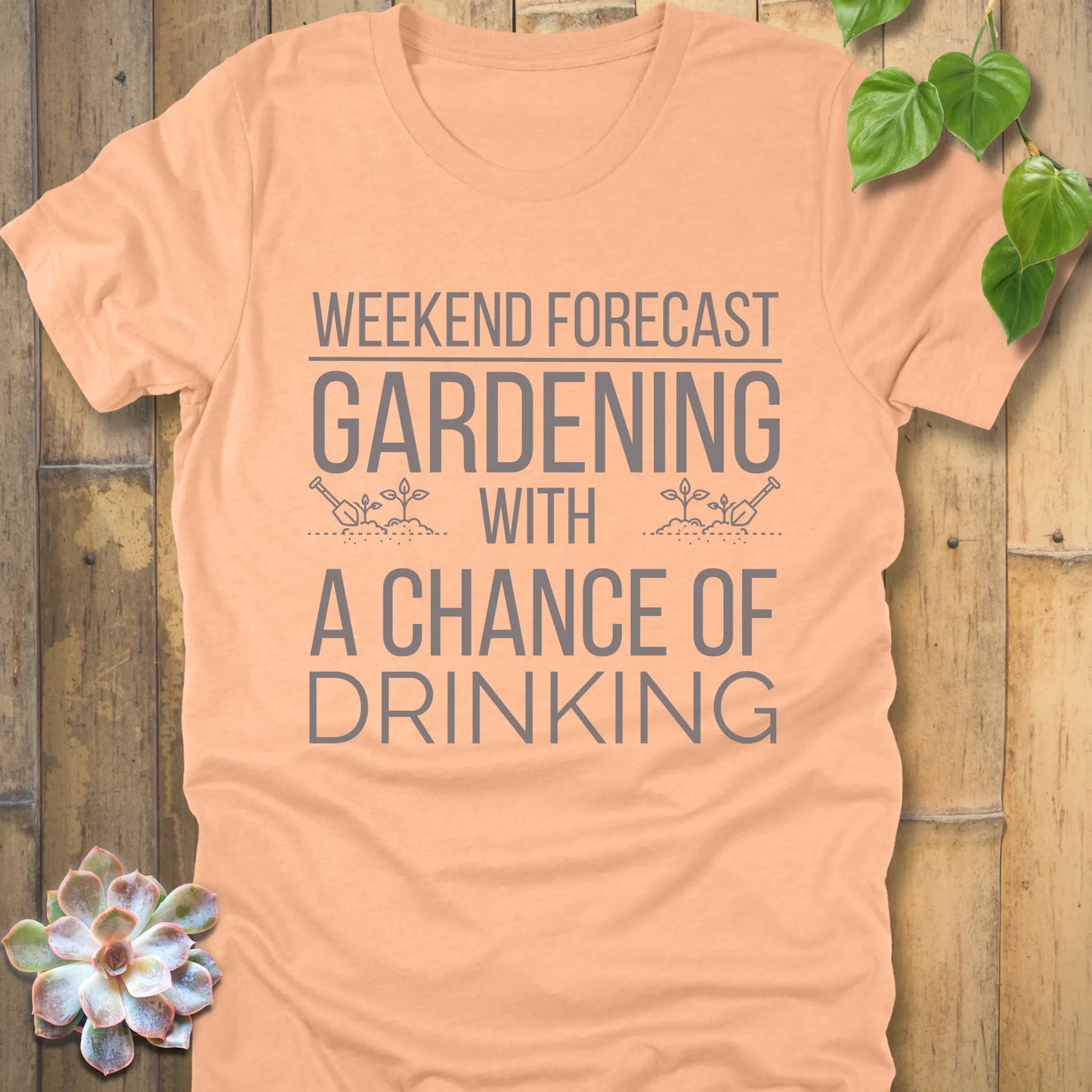 Heather Peach t-shirt featuring the design "Weekend forecast gardening with a chance of drinking" in bold letters, gardening gift tee.