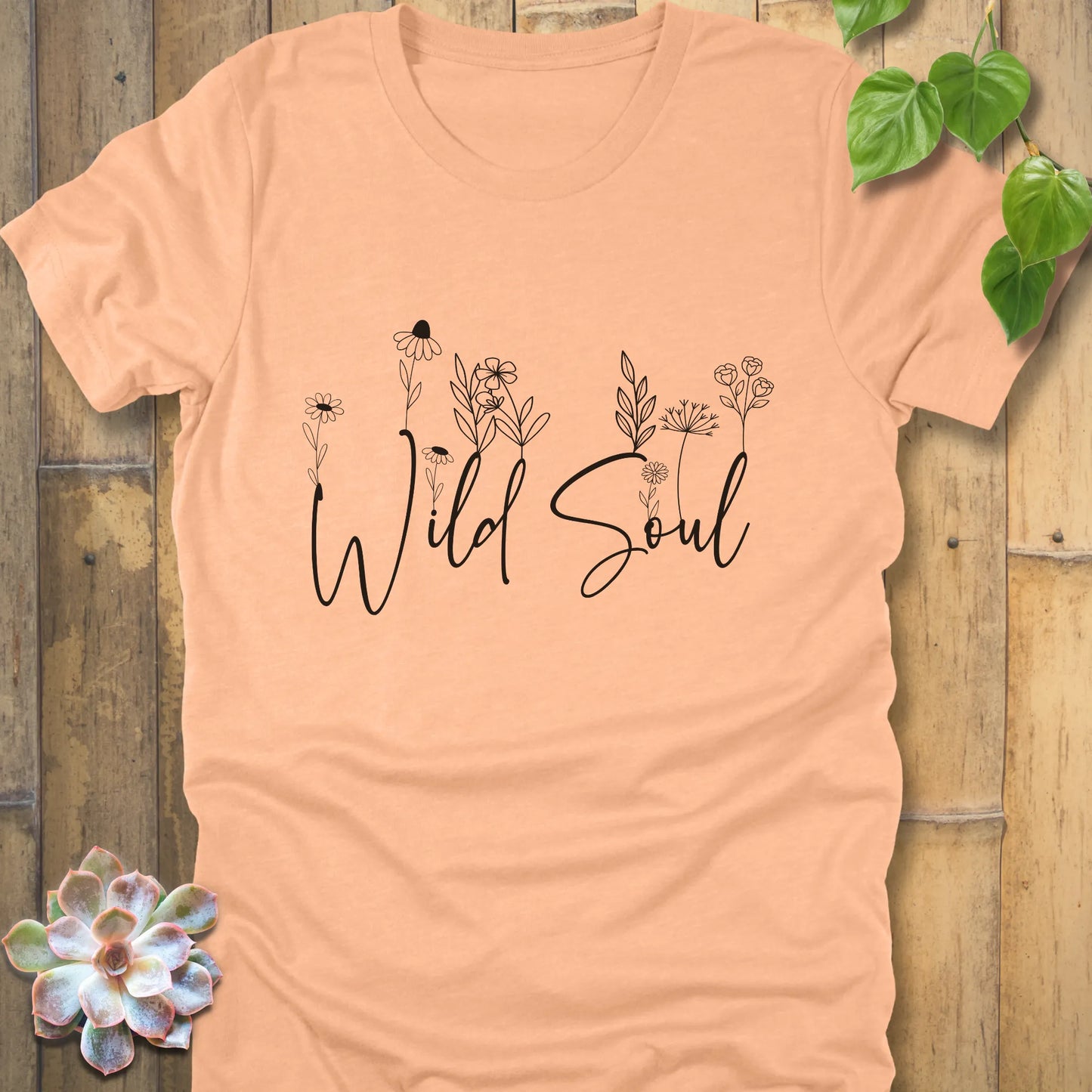 Heather Peach t-shirt featuring the design Wild Soul with a print of plants for minimalist fashion