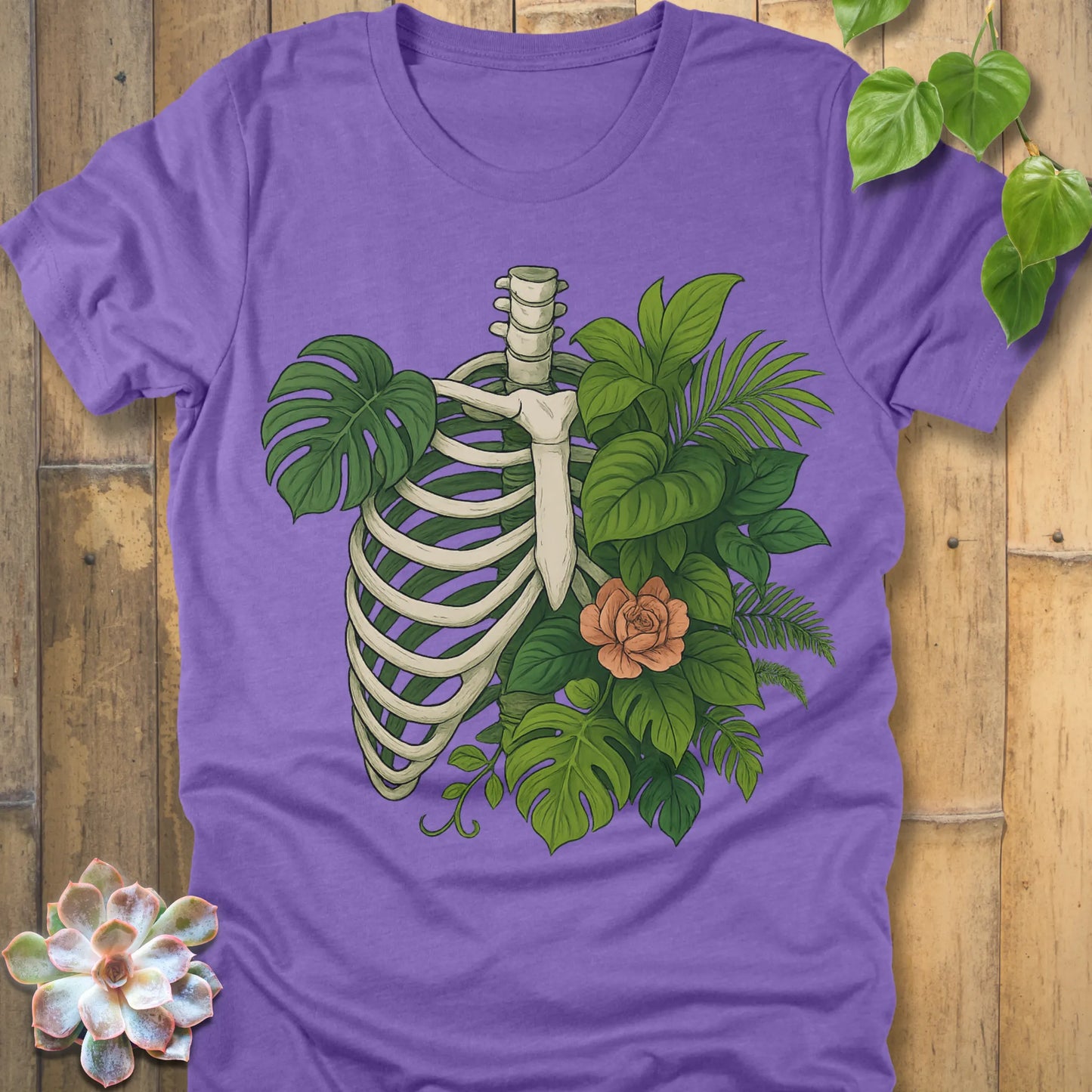 Heather Team Purple t-shirt featuring the design Jungle Bones printed in bones, leaves and flowers, casual jungle graphic shirt.