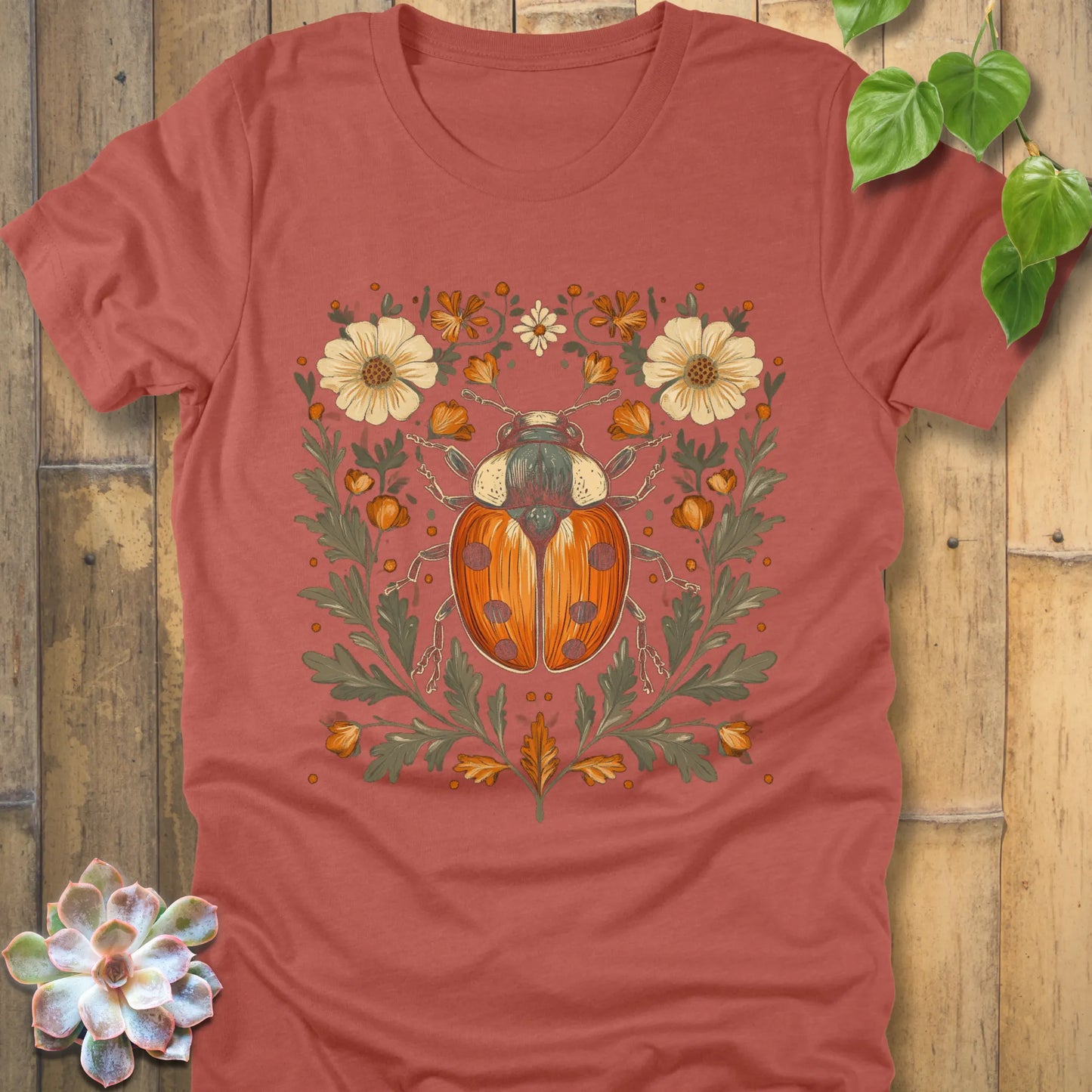 Heather clay t-shirt featuring the design Blossom Beetle printed with flowers and beetle