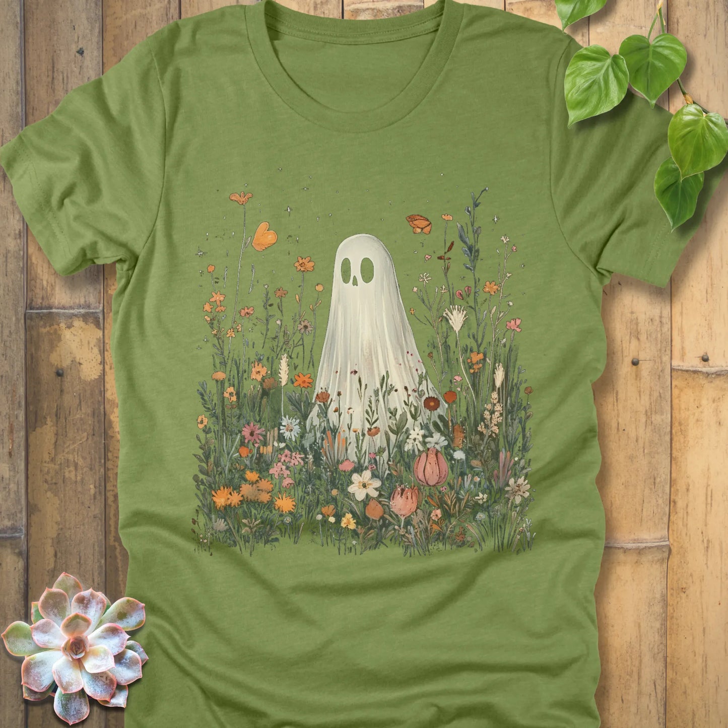 Heather green t-shirt featuring the design Among the Wildflowers printed with a ghost in garden