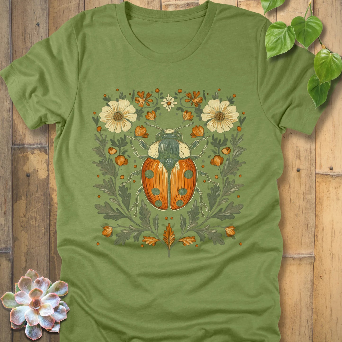 Heather green t-shirt featuring the design Blossom Beetle printed with flowers and beetle