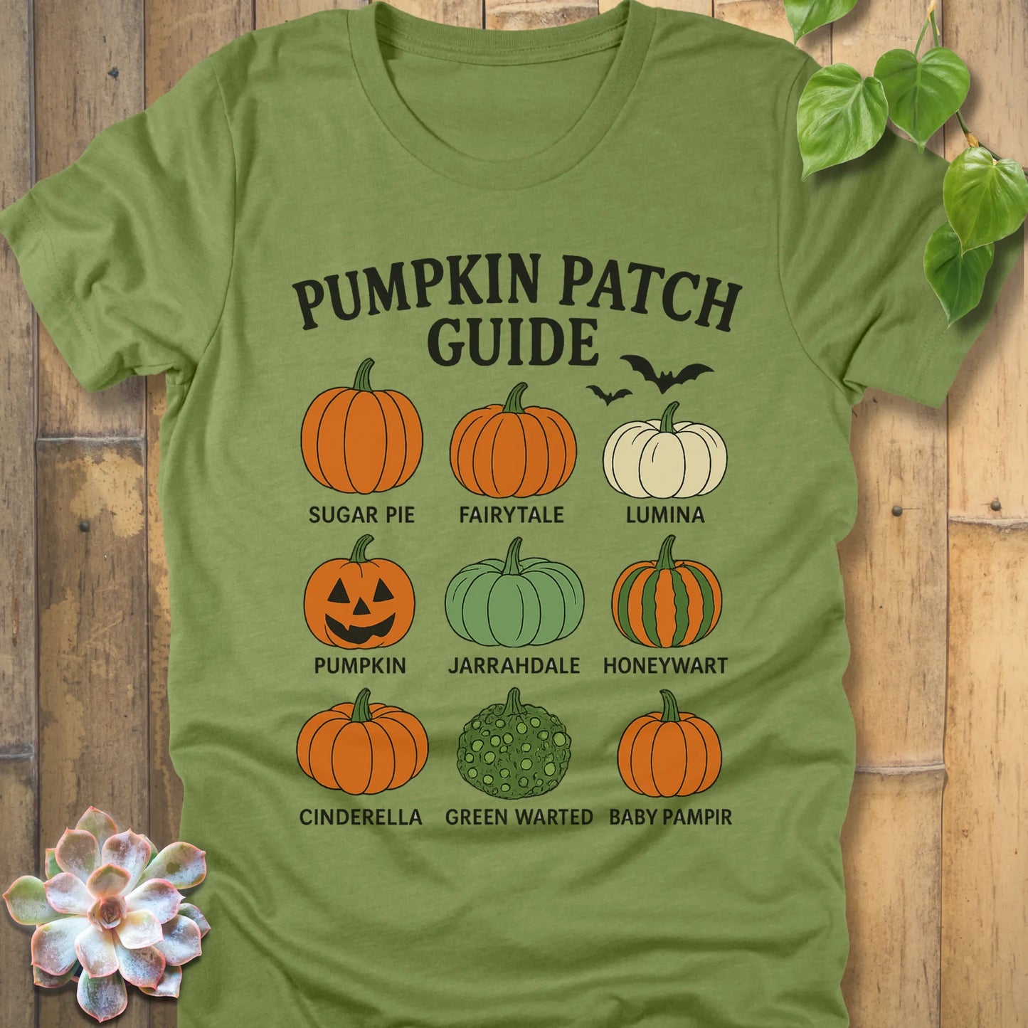 Heather green t-shirt featuring the design Pumpkin Patch Guide printed in bold black letters and pumpkin