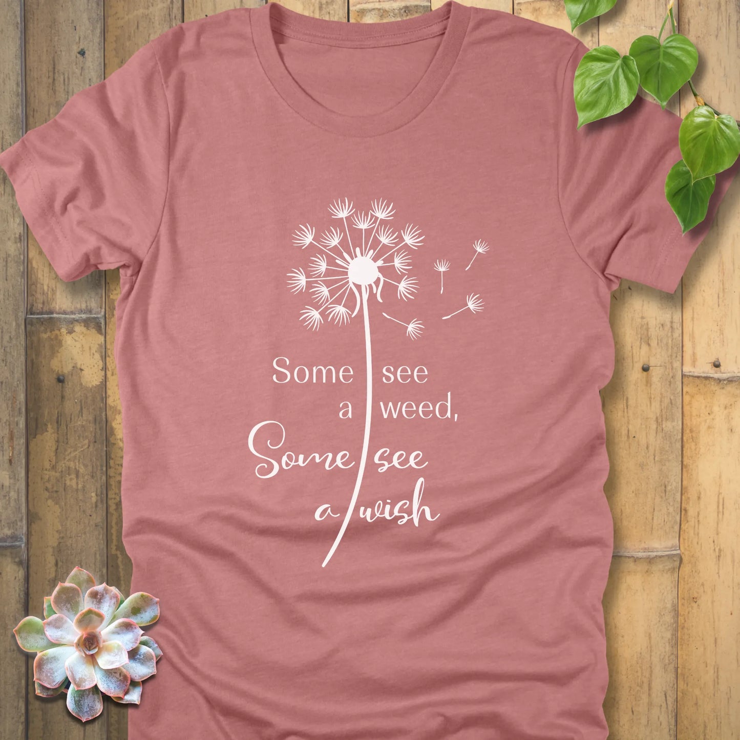 Heather mauve t-shirt featuring the dandelion design with the quote "Some see a weed, Some see a wish"