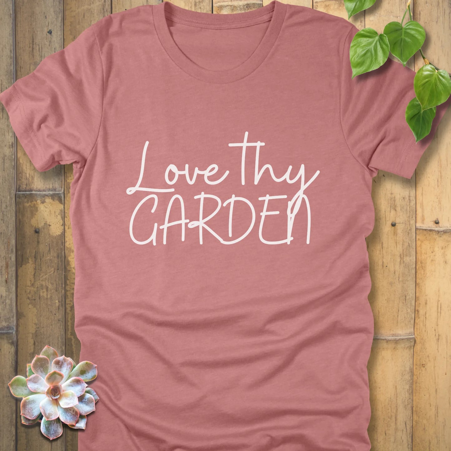 Heather mauve t-shirt featuring the design Love Thy Garden printed in white letters