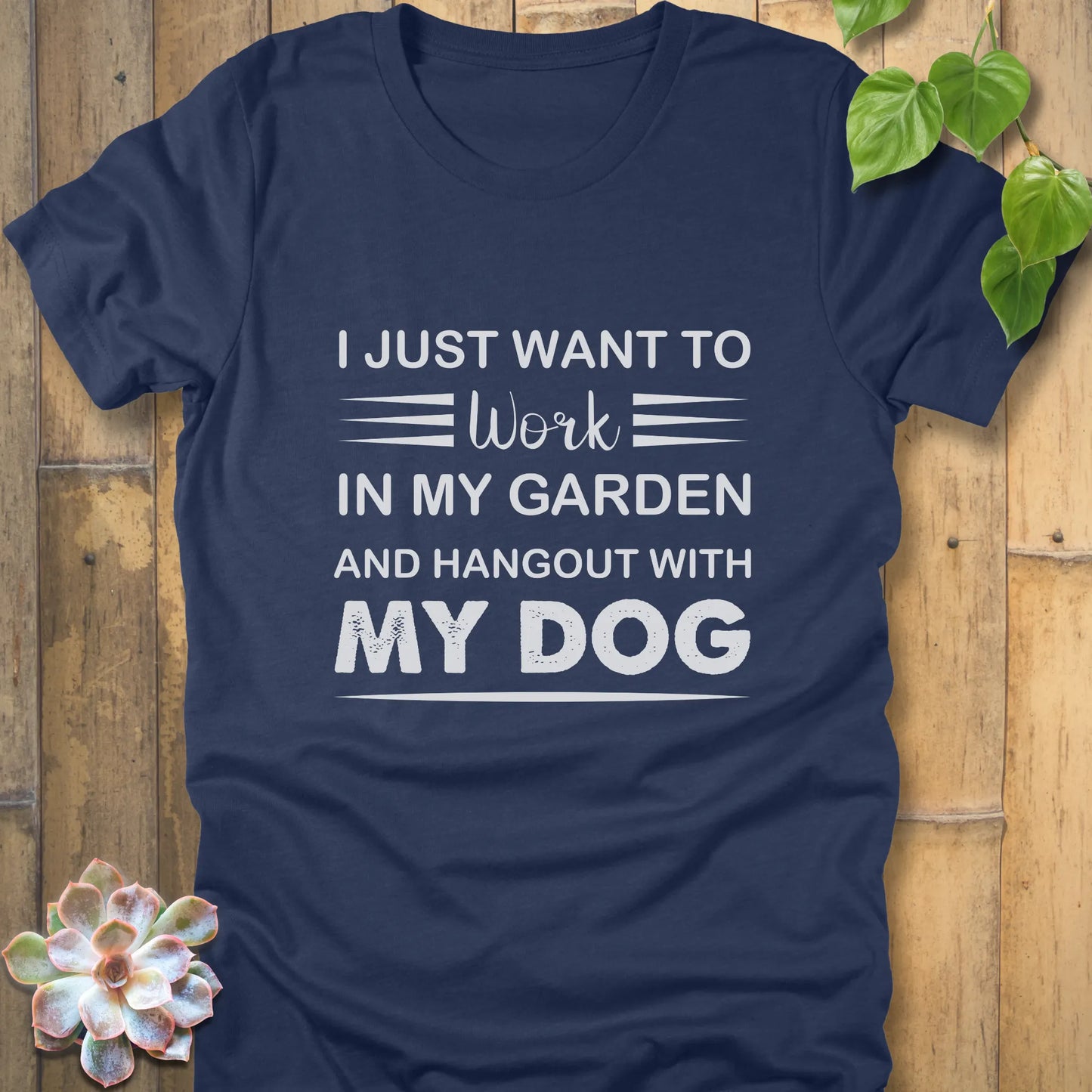 Heather navy t-shirt featuring the design "I just want to work in my garden and hangout with my dog" printed in white letters