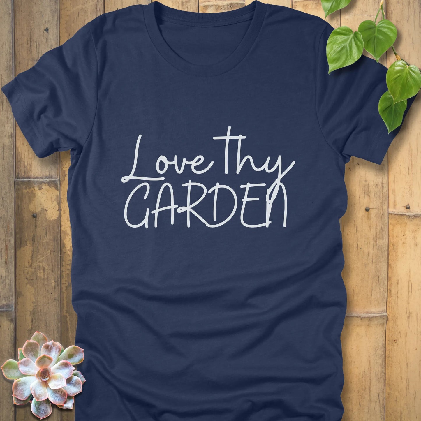 Heather navy t-shirt featuring the design Love Thy Garden printed in white letters