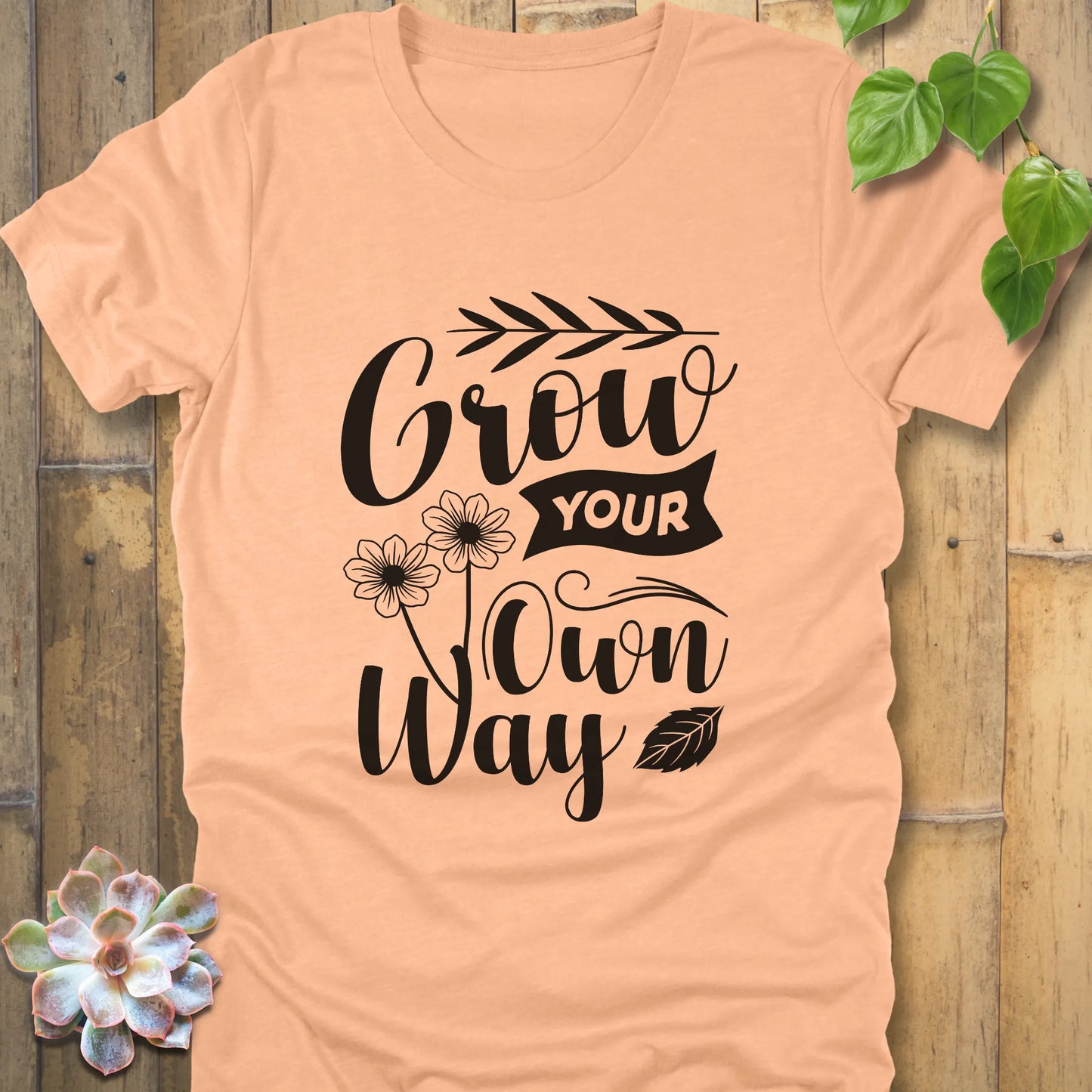 Heather peach graphic t-shirt featuring the positive design Grow your own way, lightweight cotton everyday tee.