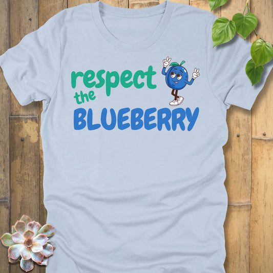 Light Blue t-shirt featuring the design Respect the Blueberry with a bold blueberry graphic, funny fruit lover shirt.