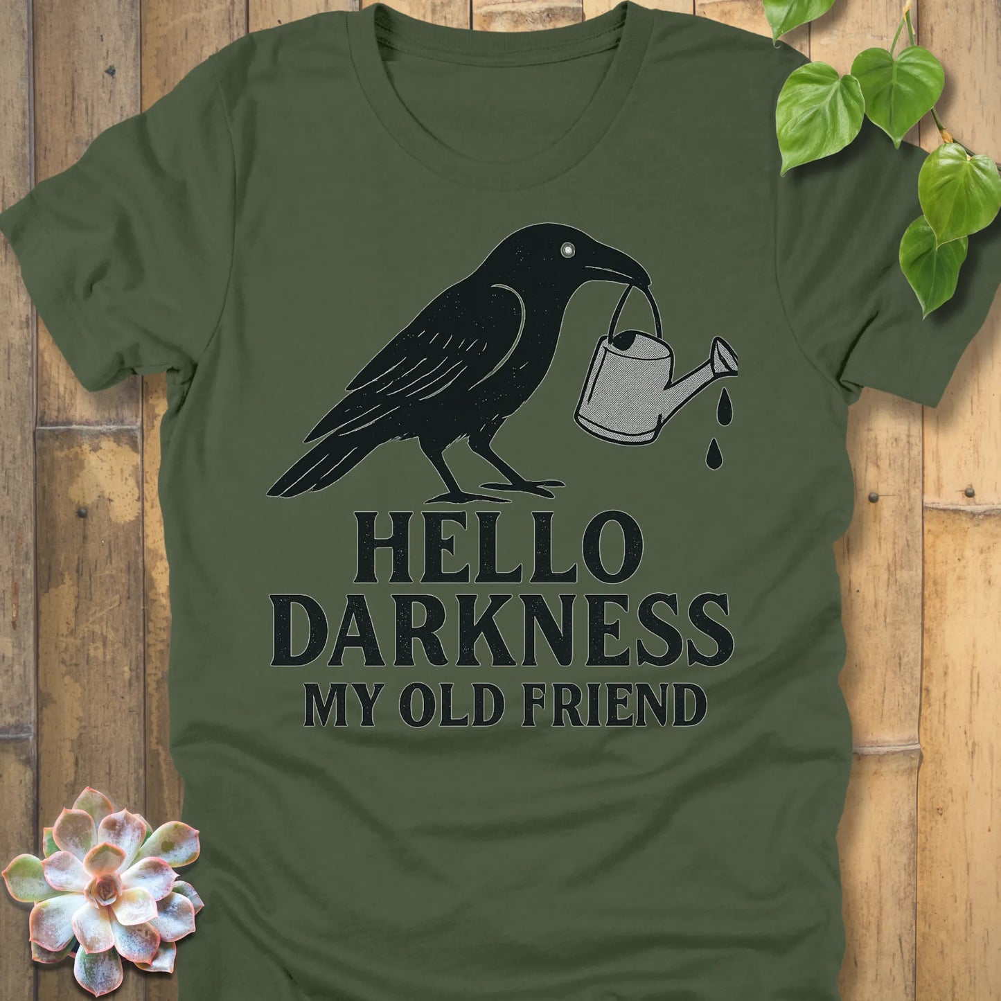 Military Green – Hello Darkness T-shirt in Military Green, crow with watering can print, soft Bella+Canvas 3001 cotton tee.