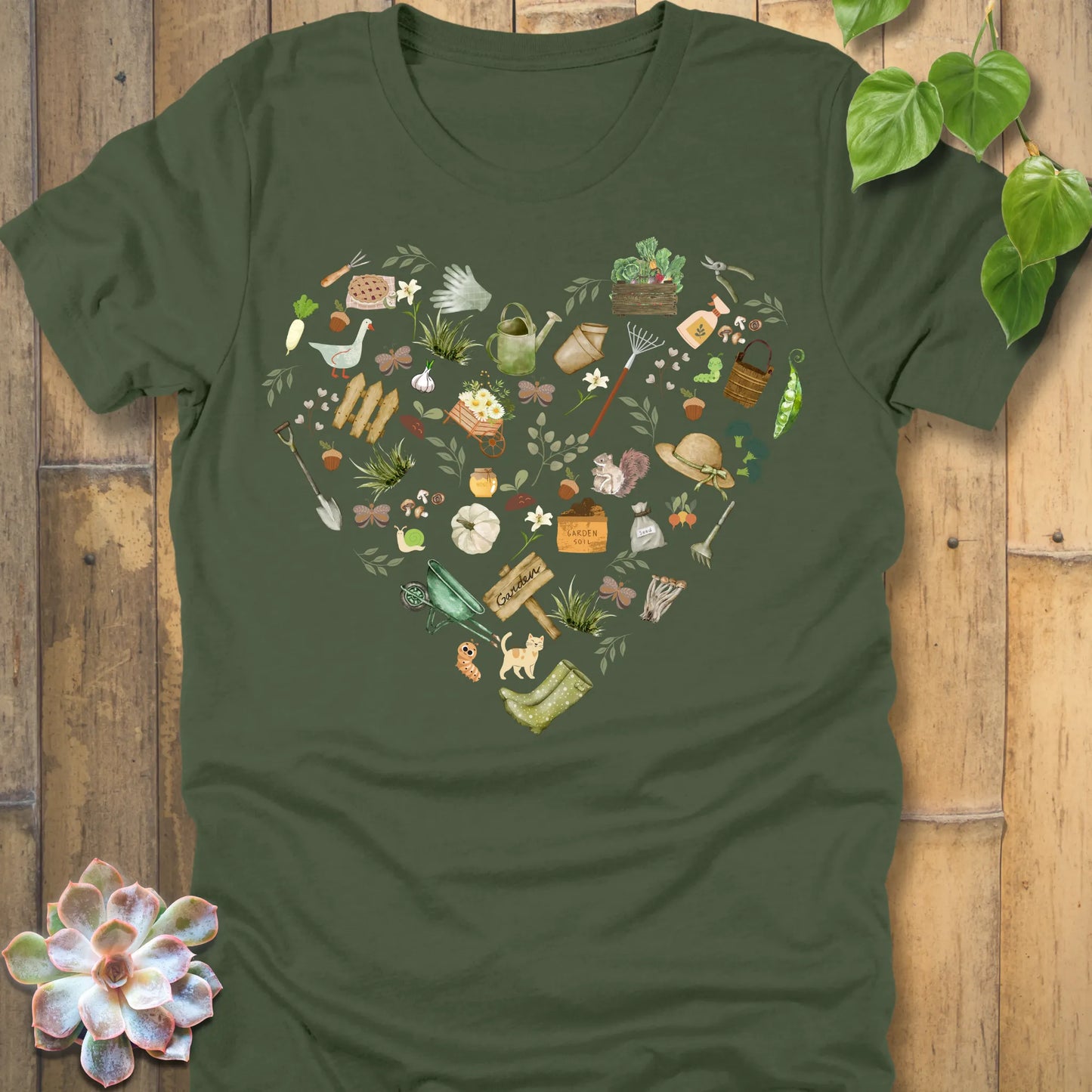 Military Green t-shirt featuring the design Gardening Loveheart printed in heart shape with tools, plant lover shirt.