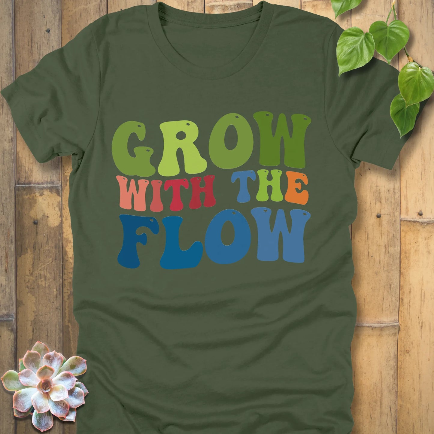 Military Green t-shirt featuring the design Grow In The Flow printed in colourful bold letters