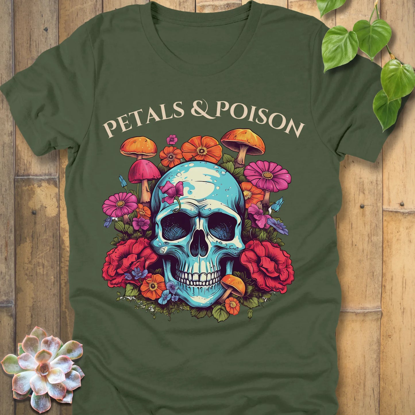 Military Green t-shirt featuring the design Petals & Poison printed in bold letters and a flowers, mushroom and skull