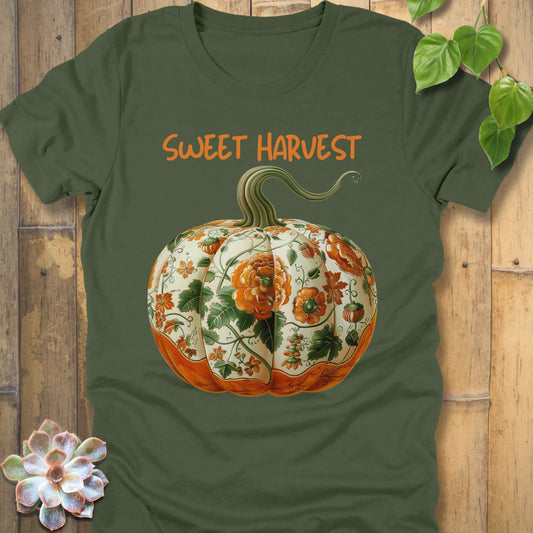 Military Green t-shirt featuring the design Sweet Harvest printed in bold orange letters and a halloween pumpkin design
