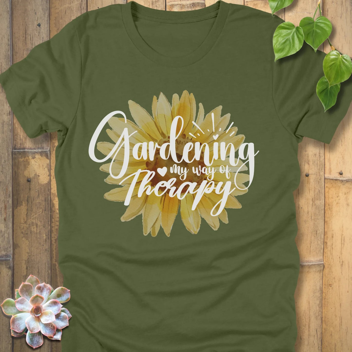 Military green t-shirt featuring the design Gardening my way of therapy with a sunflower in the center.