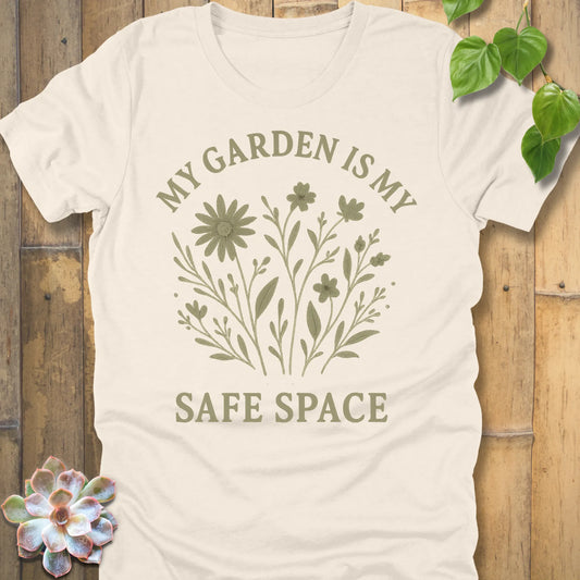 Natural t-shirt featuring the design My Garden Is My Safe Place printed in bold letters, gardening shirt for plant lovers.