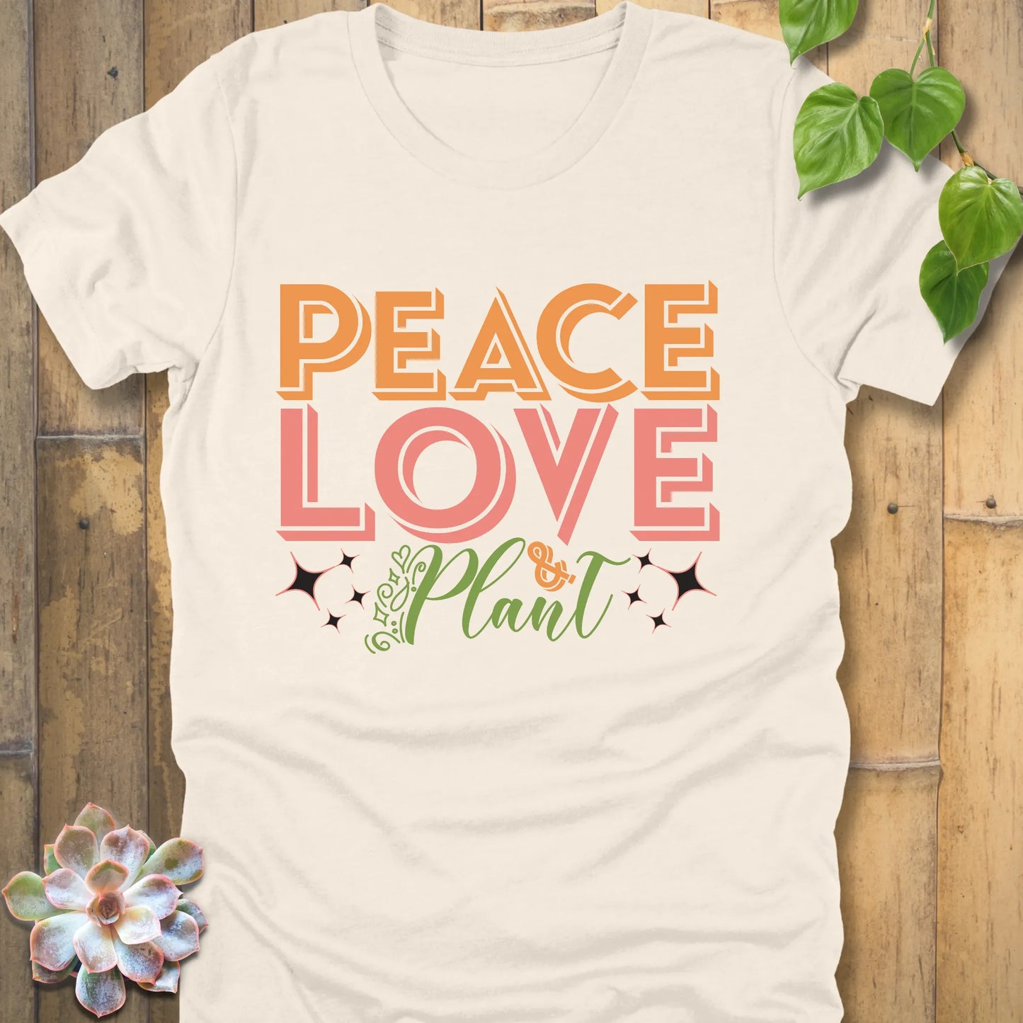 Natural t-shirt featuring the design Peace Love Plant printed in bold letters, ethical everyday wear shirt