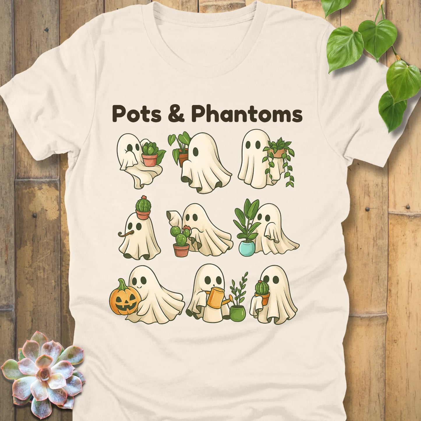 Natural t-shirt featuring the design Pots & Phantoms printed in  black letters and a ghost holding a plants, pumpkin and water sprinkler