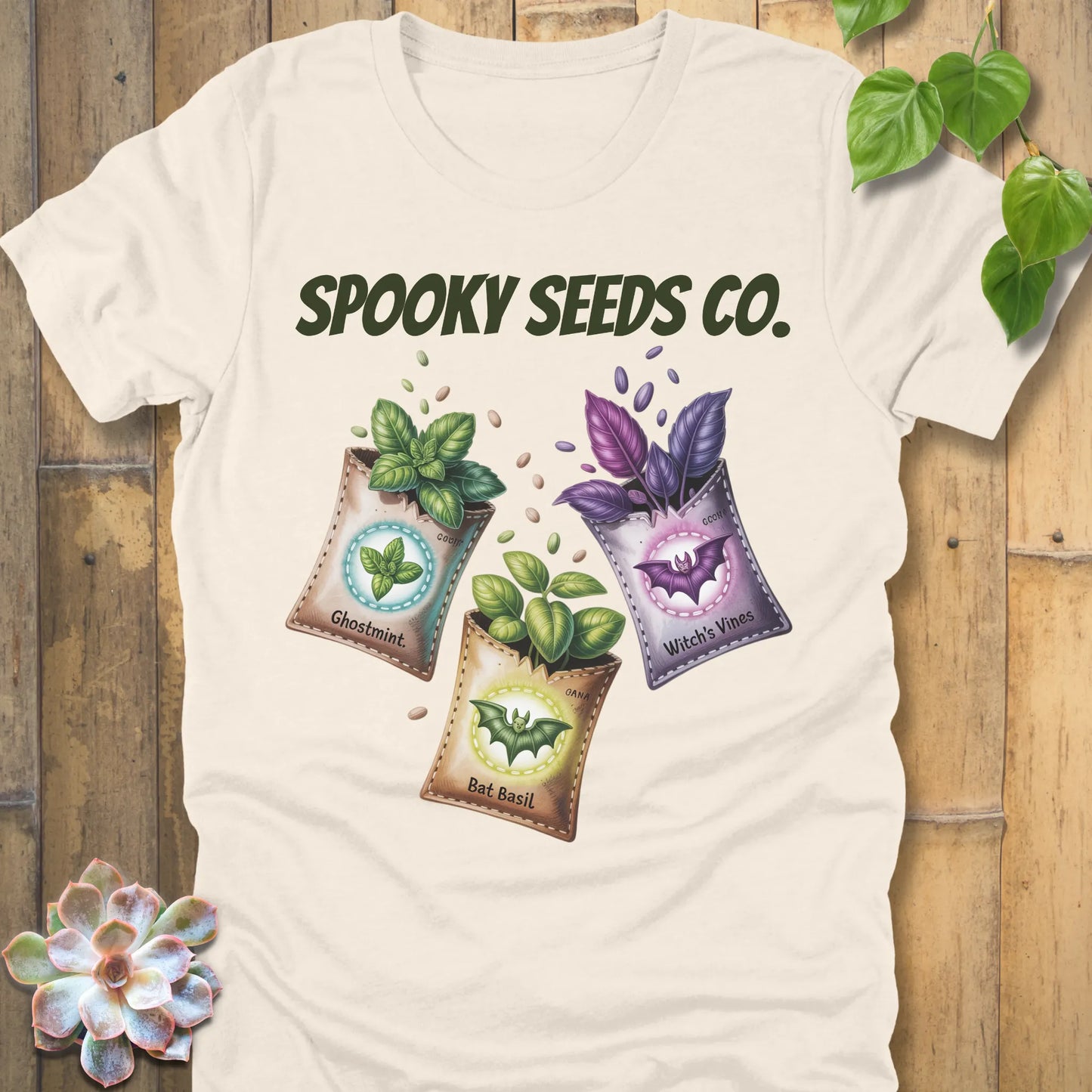 Natural t-shirt featuring the design Spooky Seeds Co. printed in bold letters  and a halloween design and plants