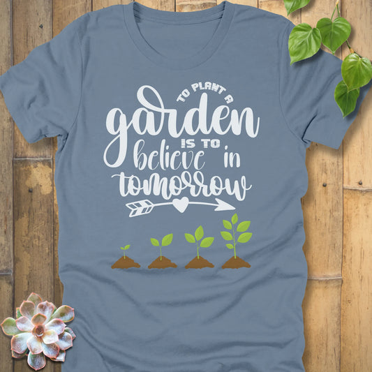 Steel Blue t-shirt featuring the design Believe In Tomorrow printed in bold white letters, inspirational quote shirt.
