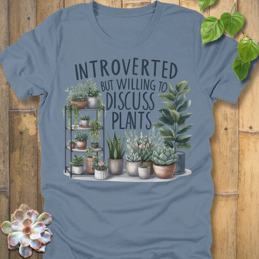 Steel Blue t-shirt featuring the design Willing To Discuss Plants printed in bold black letters, funny plant lover shirt.