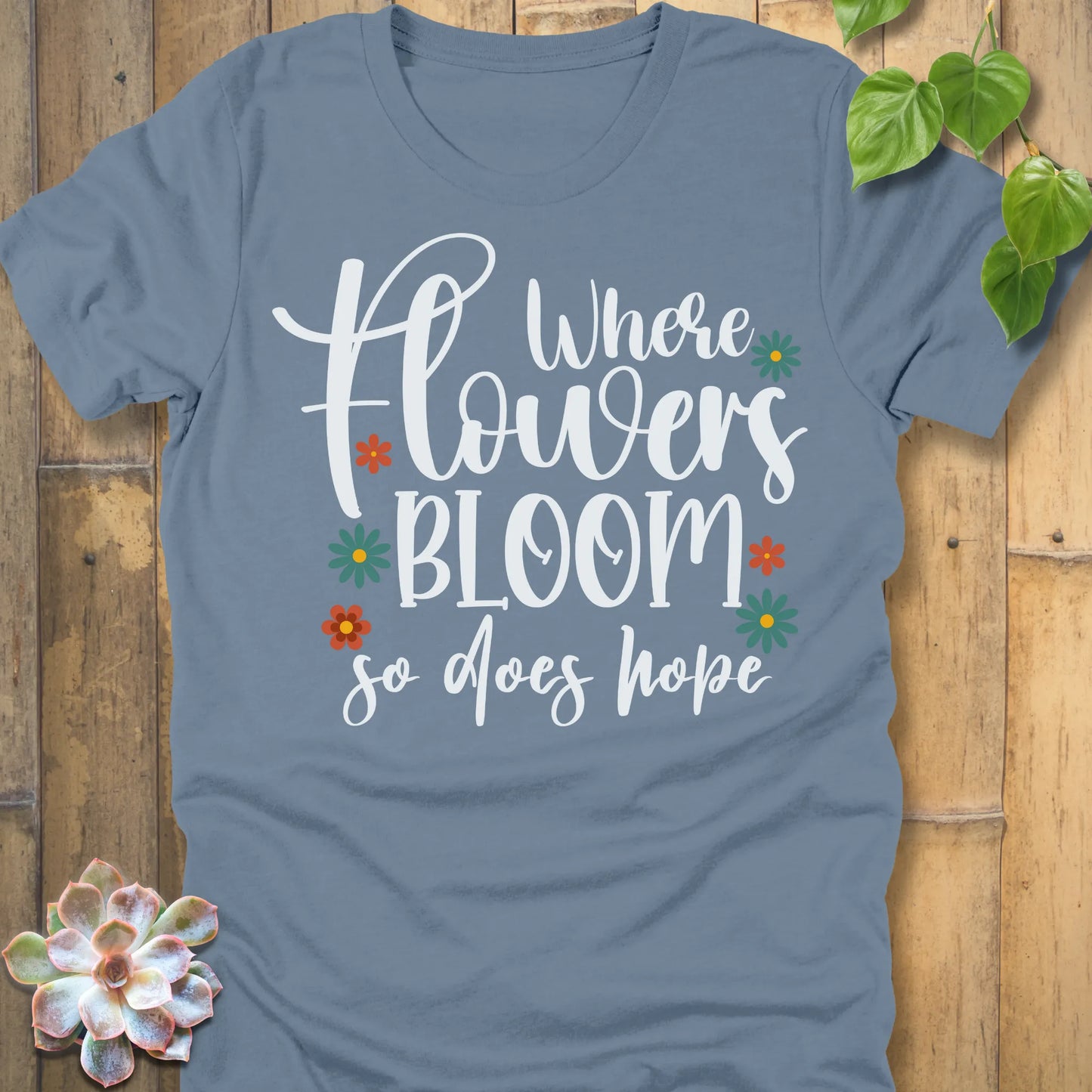 Steel blue t-shirt featuring the design Where Flowers Bloom printed floral graphic tee.